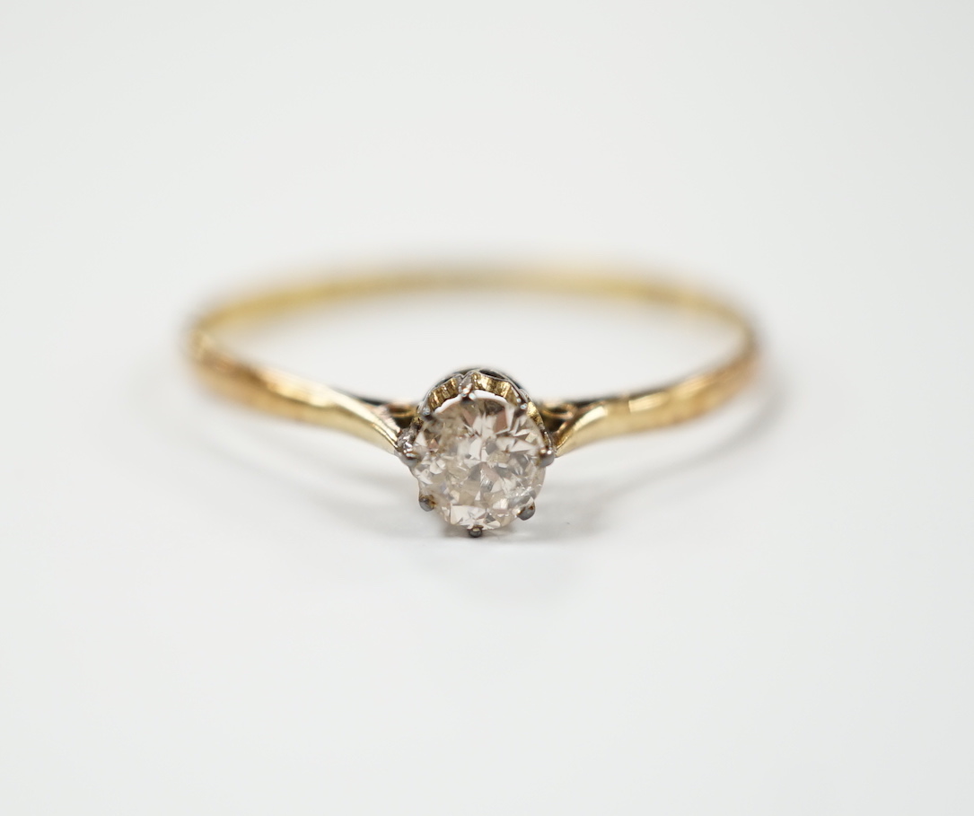 A 1920's 18ct gold and solitaire diamond set ring, size V, gross weight 1.8 grams.                                                                                                                                          