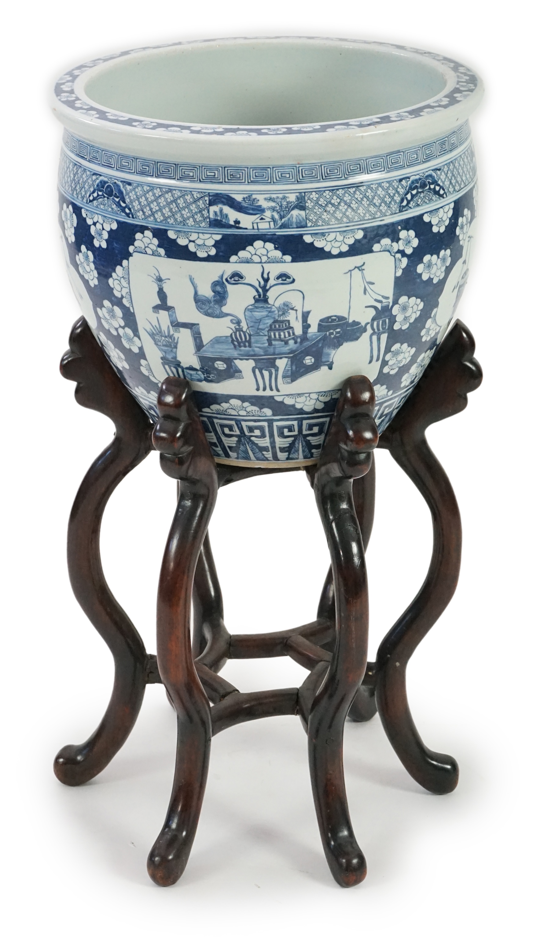 A large Chinese blue and white ‘Hundred Antiques’ jardinere and hongmu stand, late 19th/early 20th century                                                                                                                  