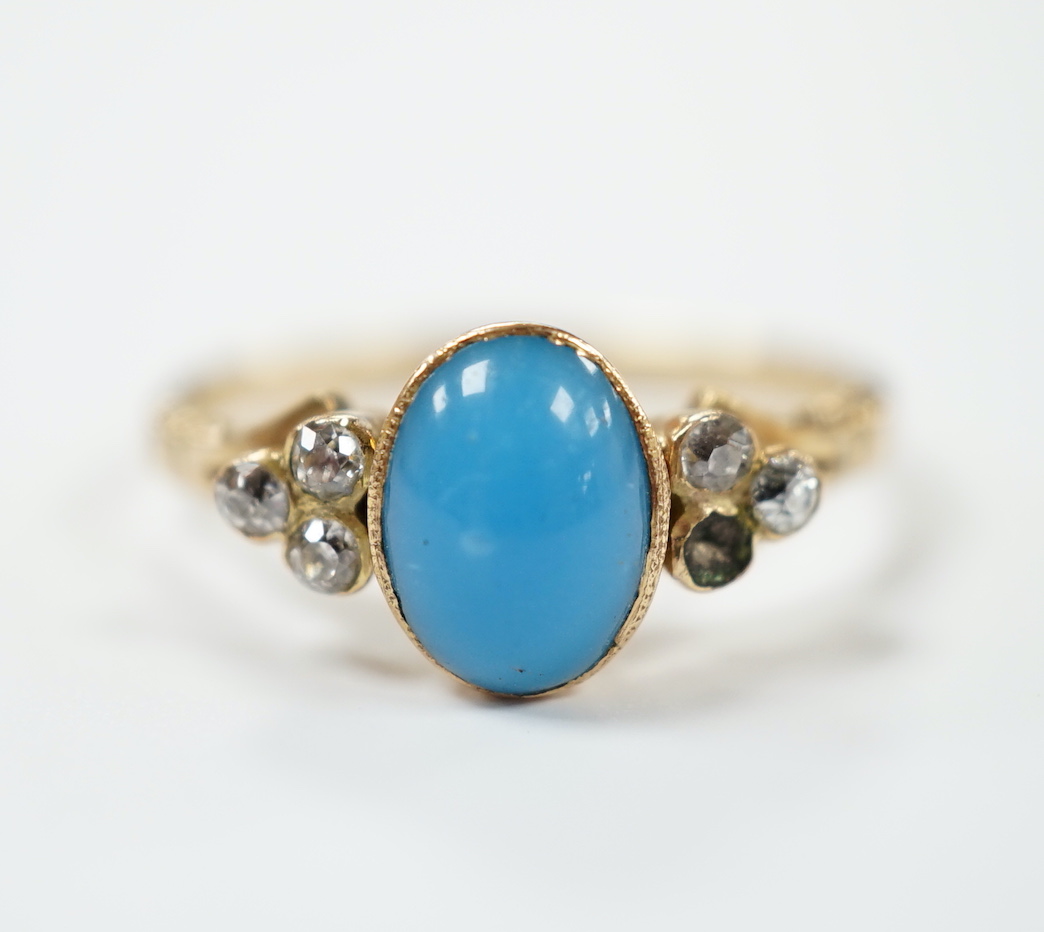 A yellow metal and single stone cabochon turquoise set ring, with six stone diamond set shoulders (stone missing), size S, gross weight 3.9 grams.                                                                          