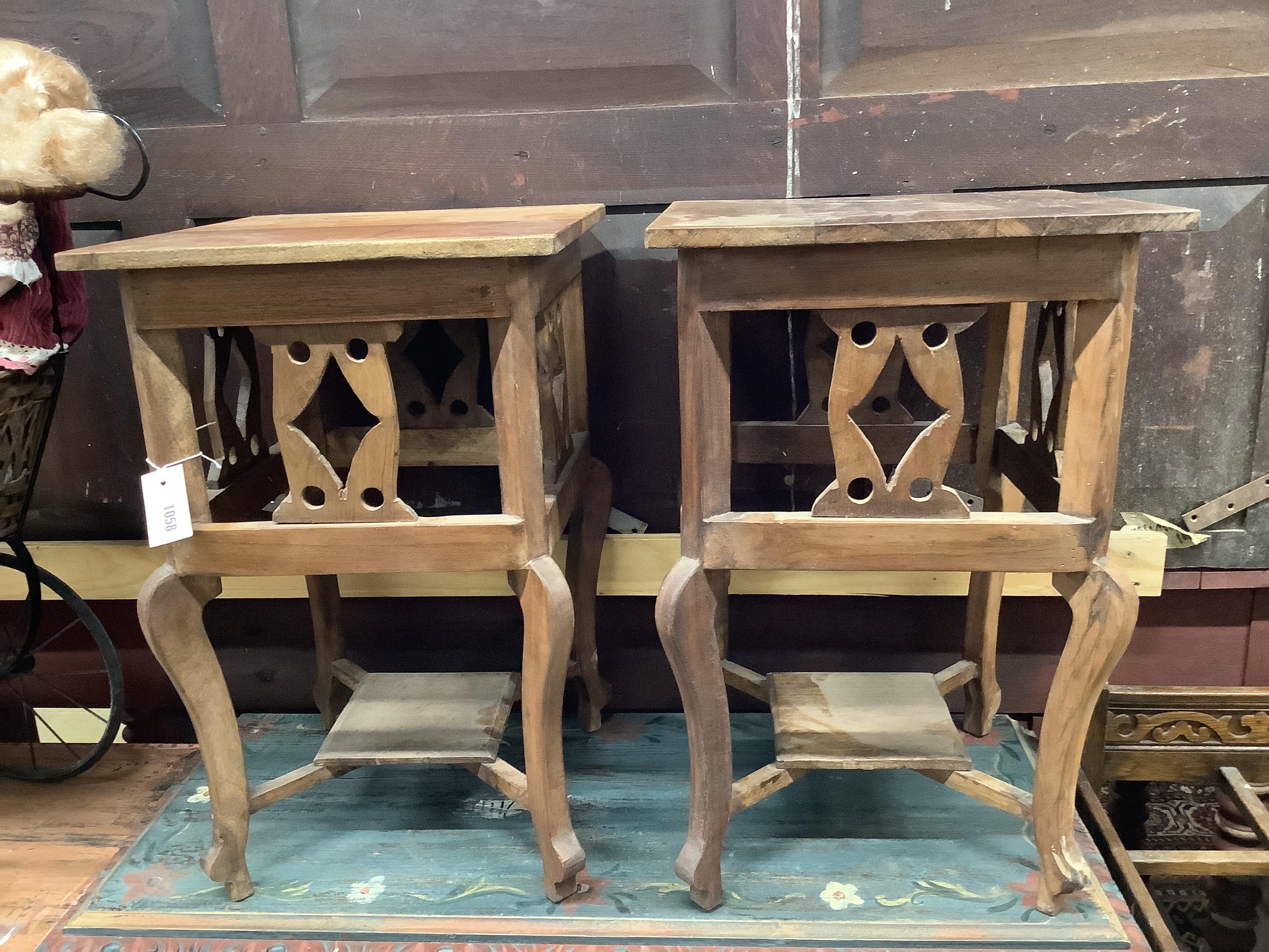 A pair of square hardwood occasional tables, width 40cm, height 62cm                                                                                                                                                        