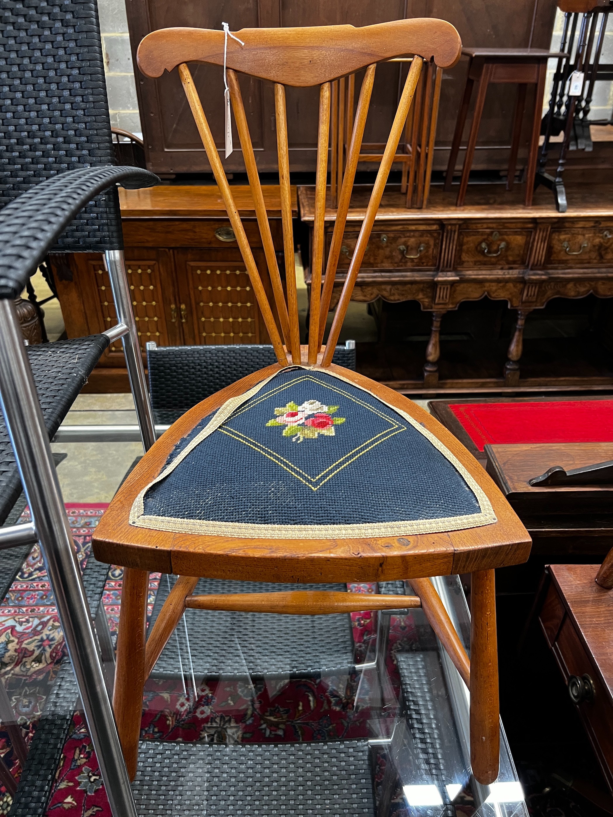 A late Victorian mahogany tapestry seat elbow chair, width 49cm, height 83cm together with a later oak side chair with triangular seat                                                                                      