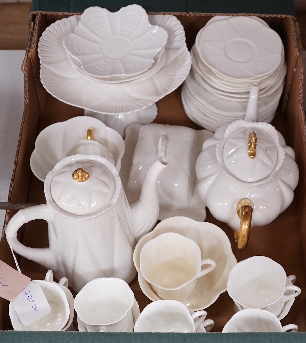 A Shelley white glazed part tea service, dainty shape, some gilt rims and handles                                                                                                                                           