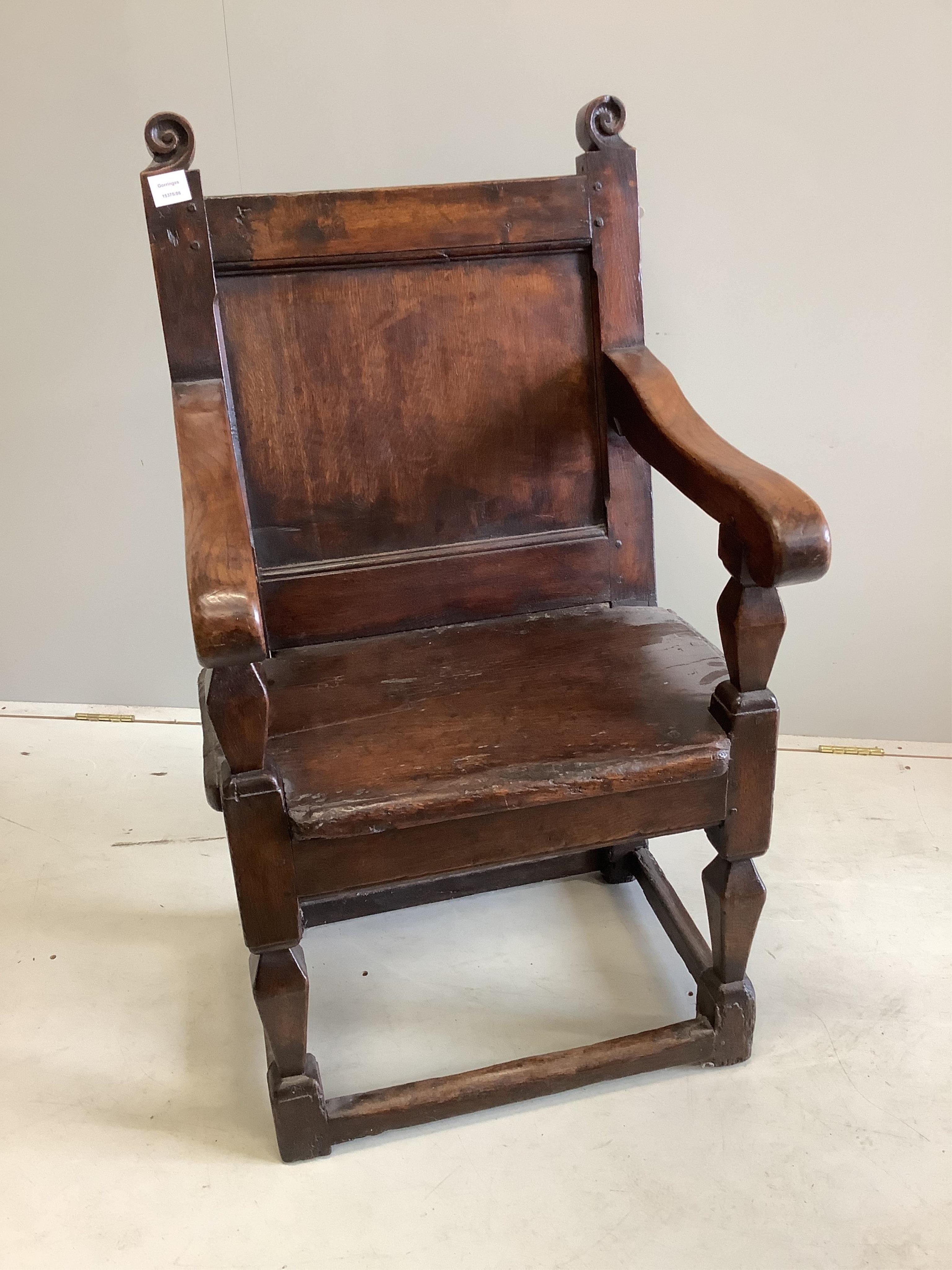 A 17th century oak wainscot elbow chair, width 58cm, depth 54cm, height 104cm. Condition - fair                                                                                                                             