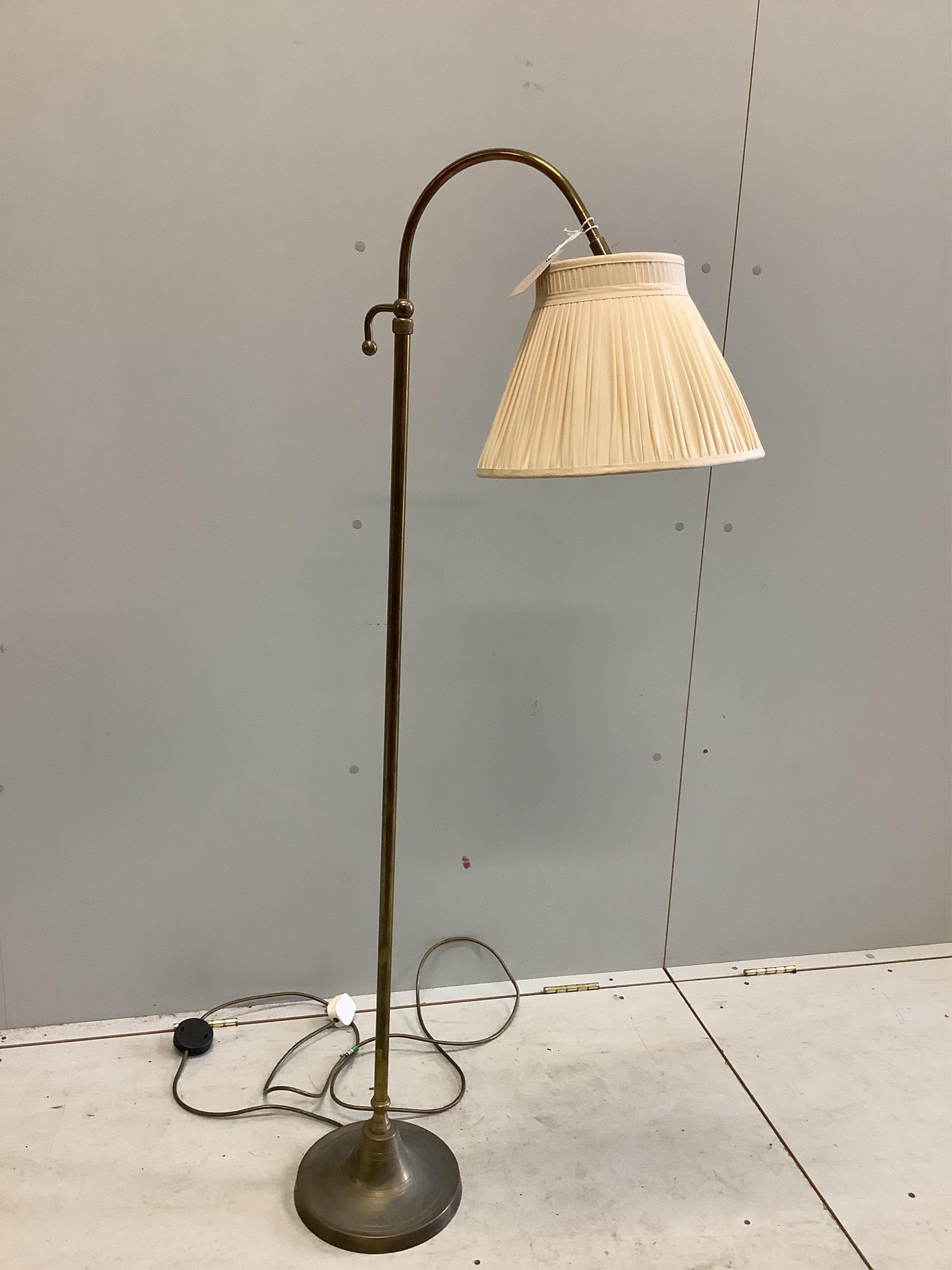 A modern adjustable brass adjustable floor lamp with shade, height 140cm. Condition - good                                                                                                                                  