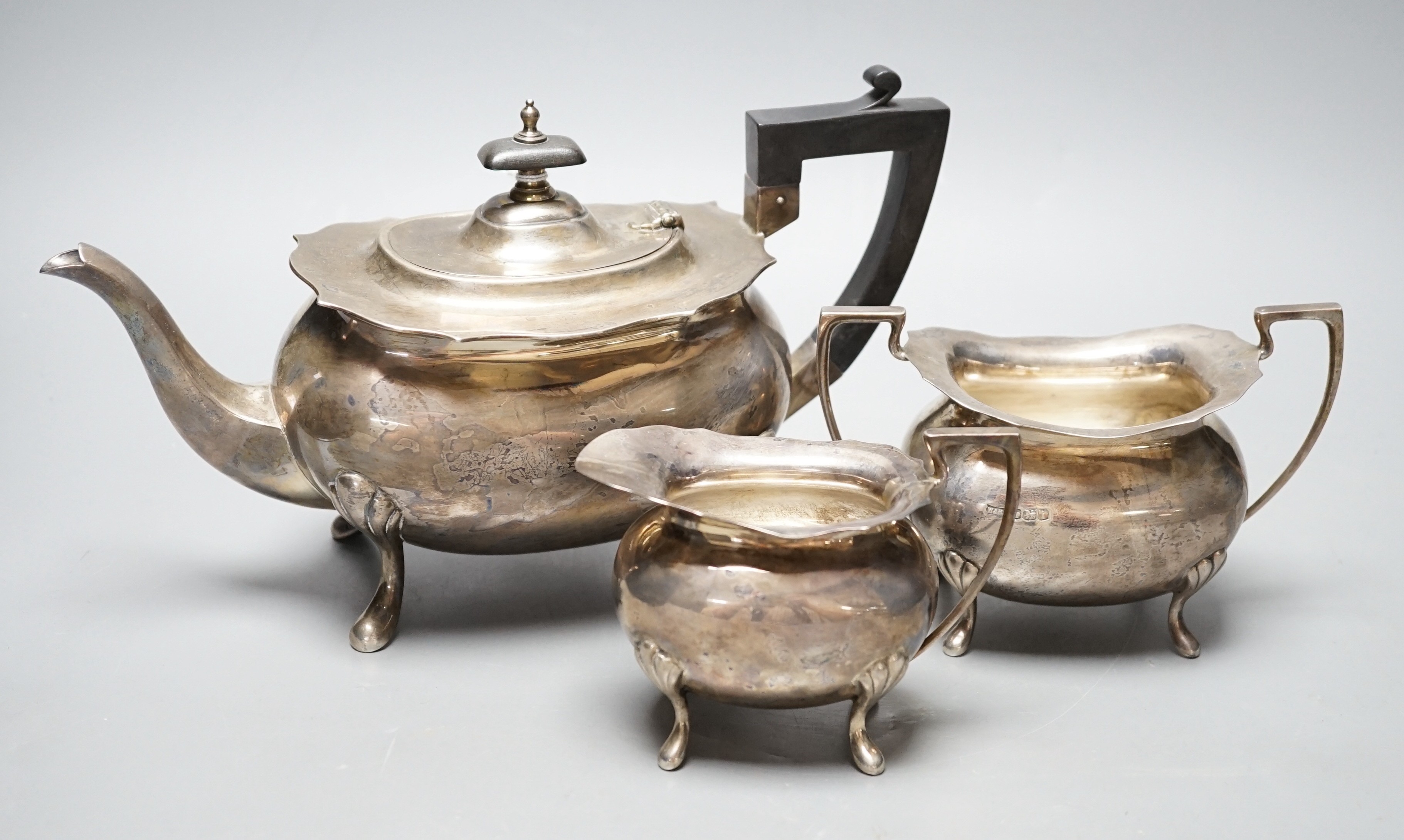 A George V silver three piece tea set, by Walker & Hall, Sheffield, 1926, gross weight 30.3oz.                                                                                                                              