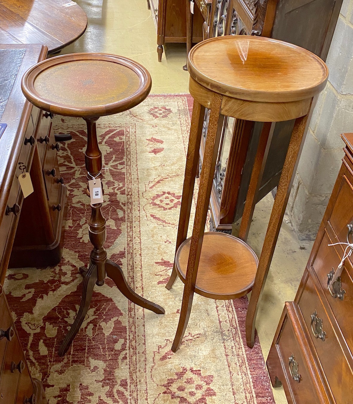 An Edwardian circular mahogany two tier plant stand, diameter 32cm, height 98cm, together with a reproduction tripod stand                                                                                                  