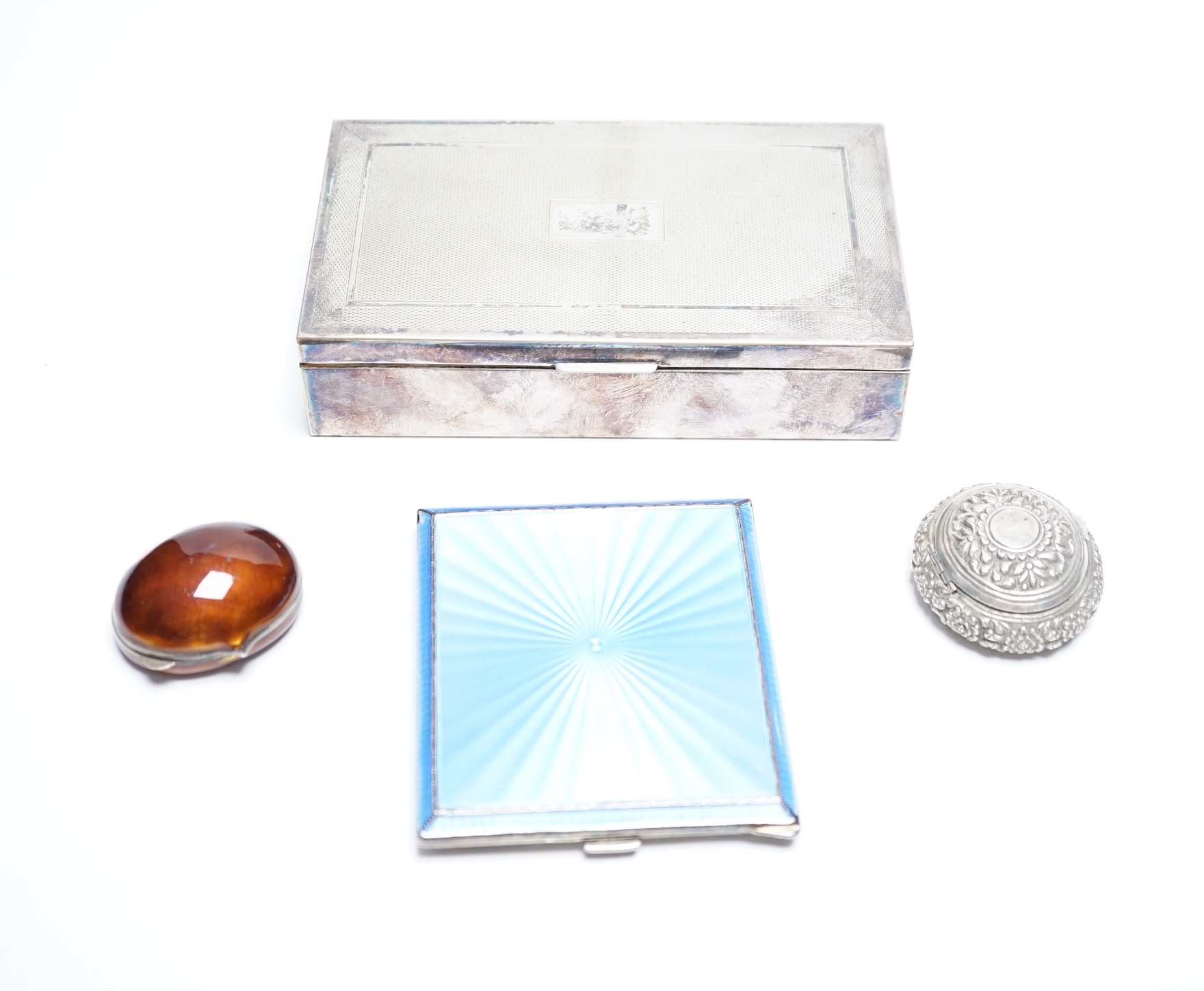 A George VI silver and guilloche enamel cigarette case, Birmingham, 1939, 93mm, a silver mounted cigarette box and two other small boxes including enamelled 'shell' box(a.f.).                                             