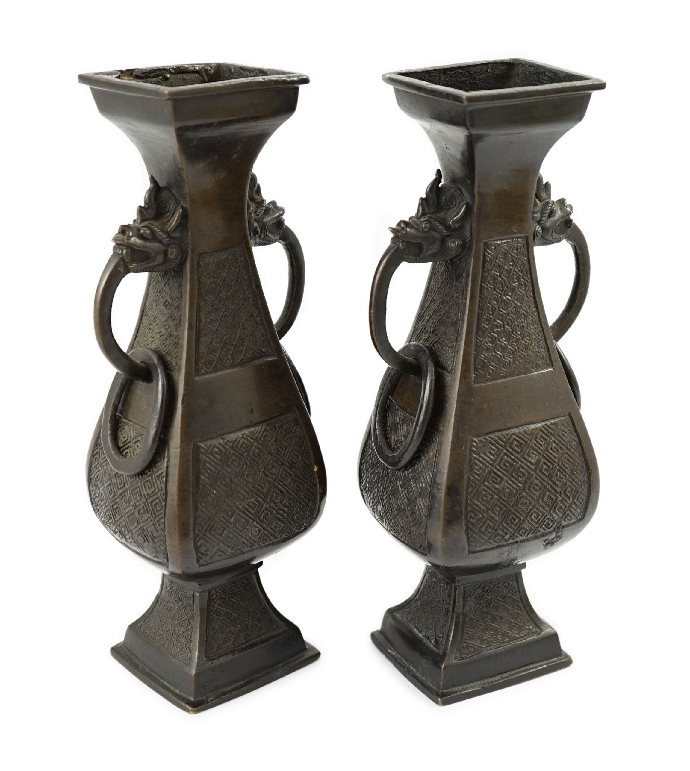 A pair of Chinese archaistic bronze two handled altar vases, Ming dynasty, 23cm high                                                                                                                                        