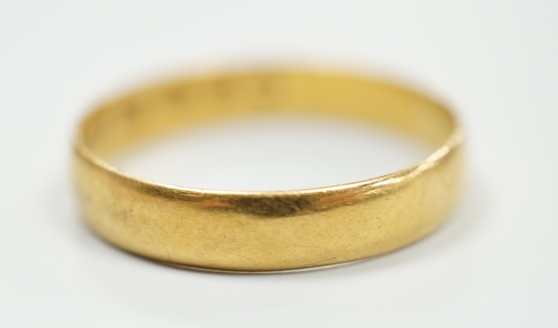 A Victorian 22ct gold wedding band, Birmingham, 1861, size P, 2.3 grams.                                                                                                                                                    