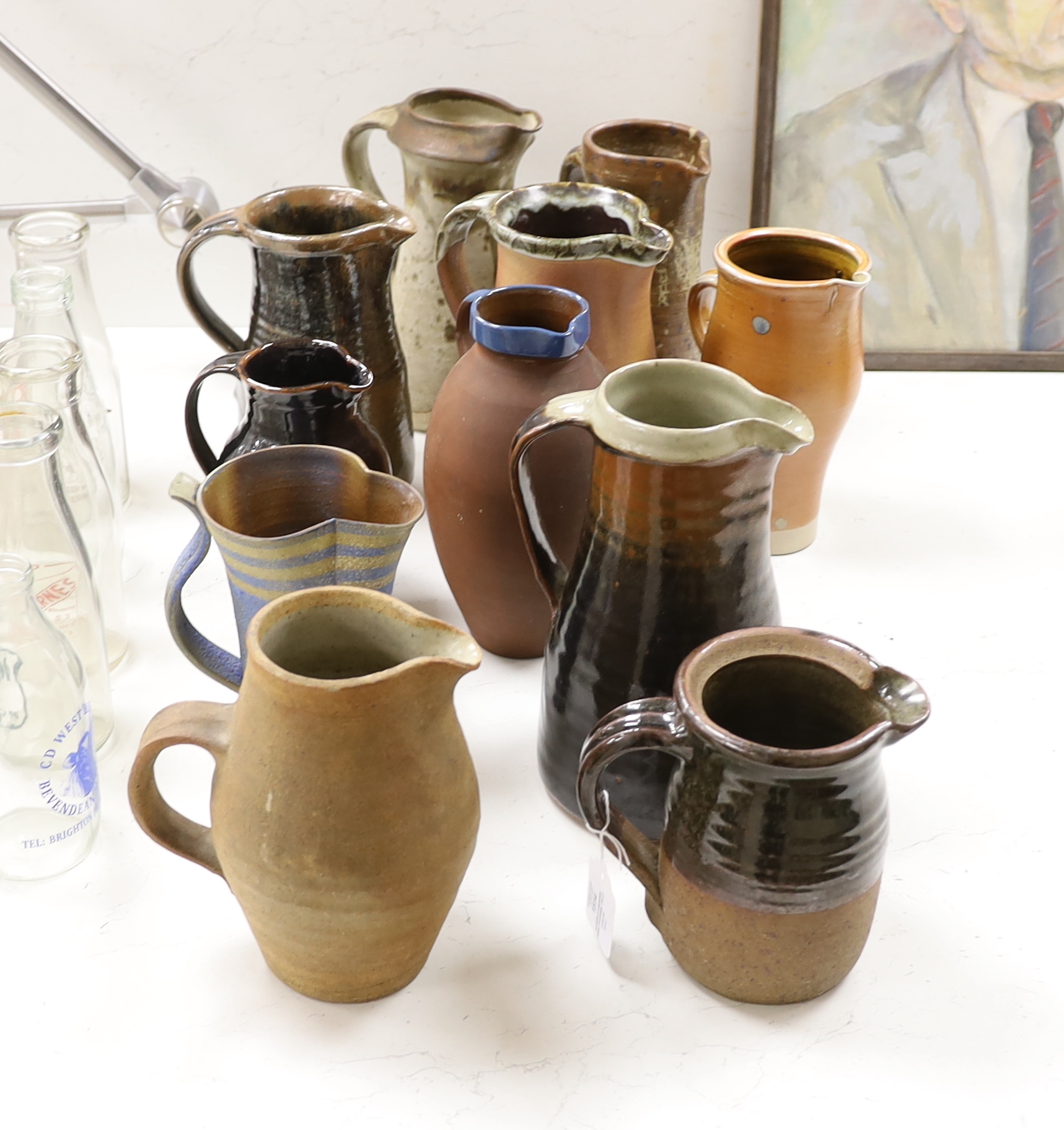 Eleven studio stoneware jugs / pitchers, including Muchelney tallest 26cm                                                                                                                                                   