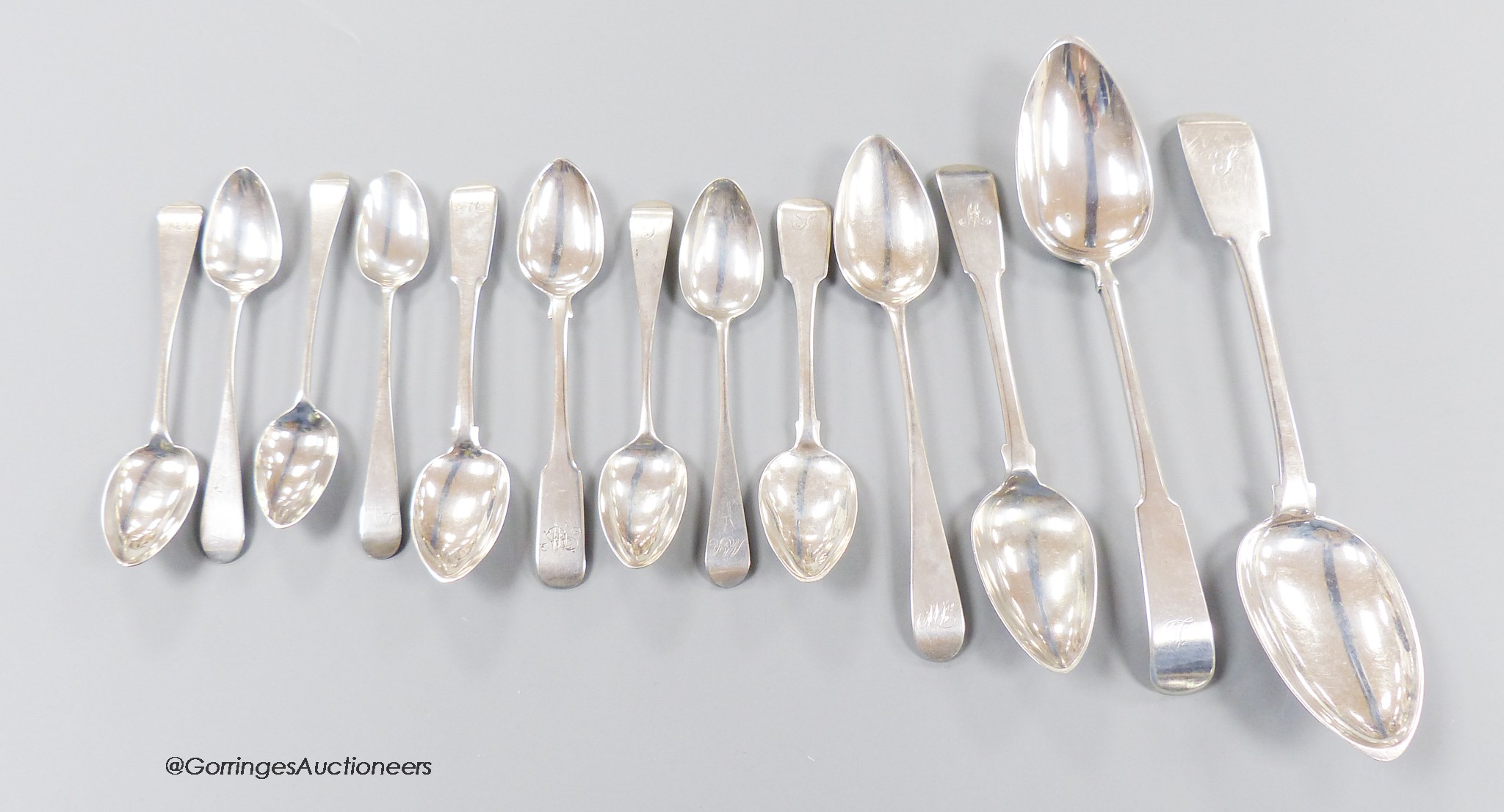 A collection of thirteen mainly 19th century Scottish provincial Banff silver spoons, including two fiddle pattern table spoons, John Keith & William Simpson, 22.5cm, two dessert spoons, John Keith and George Elder and n