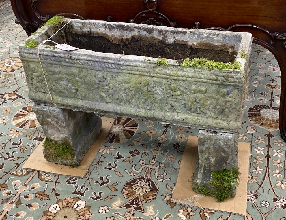 A rectangular reconstituted stone garden planter, width 64cm, depth 23cm, height 47cm                                                                                                                                       