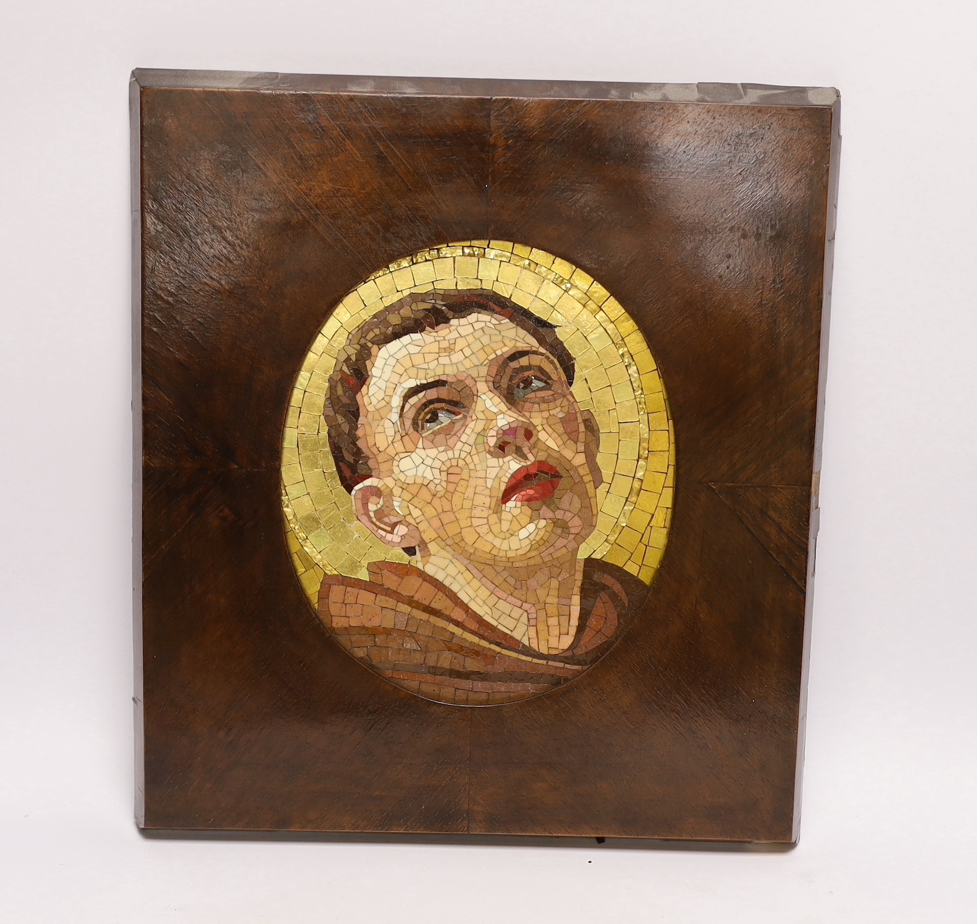 An Italian mosaic oval panel of a saint in a mahogany frame, panel 23cm high x 19cm wide                                                                                                                                    