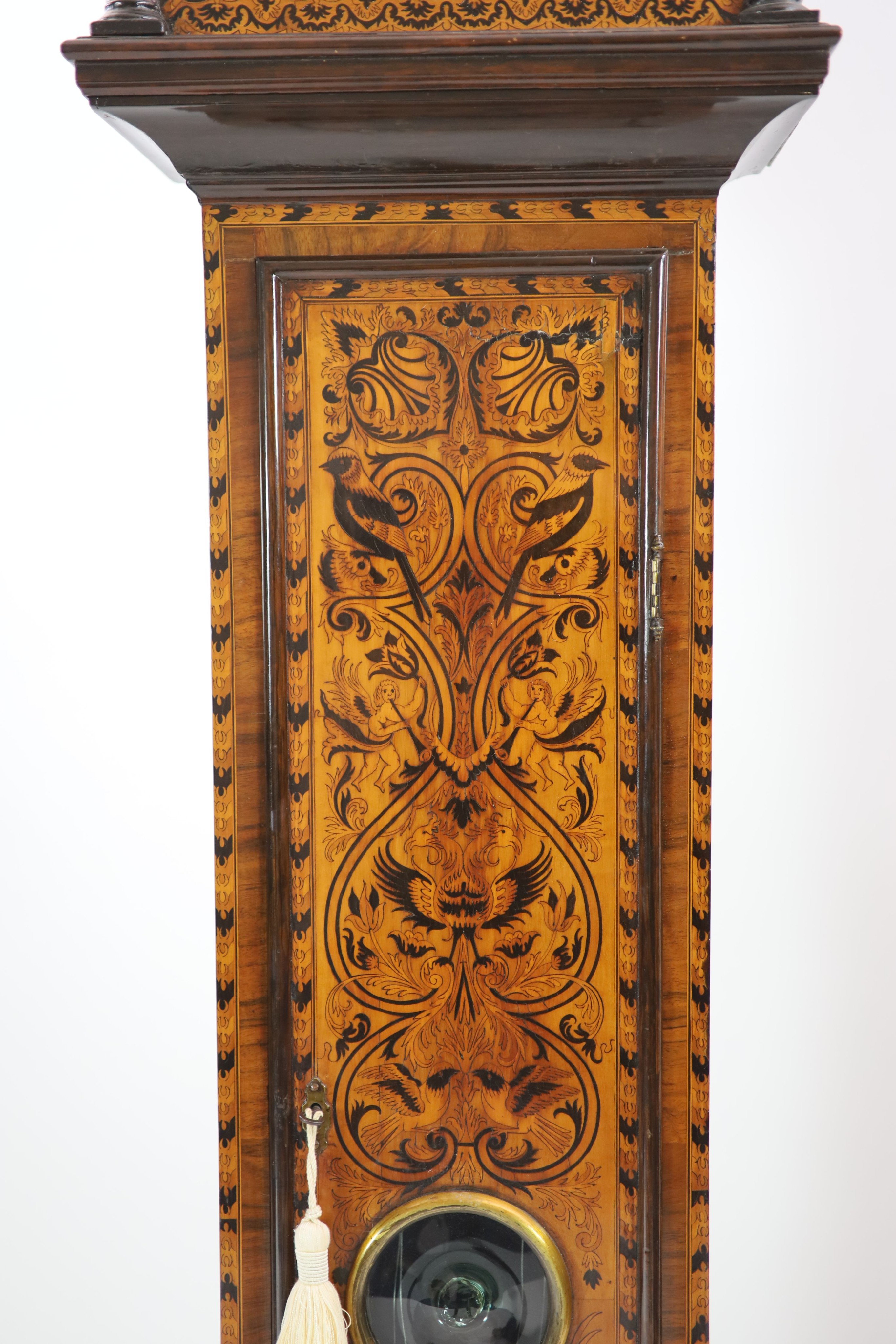 James Desenne of Shoreditch. A late 17th century marquetry inlaid walnut eight day longcase clock H 217cm. W 49cm.                                                                                                          