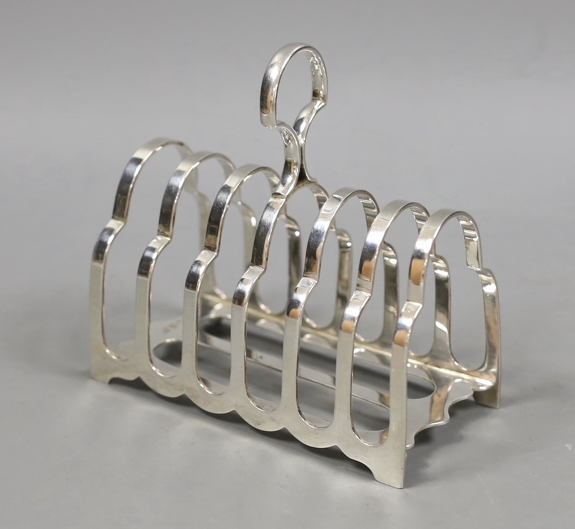 A George V silver seven bar toast rack, George Howson, Sheffield, 1926, length 13cm, 7.7oz.                                                                                                                                 