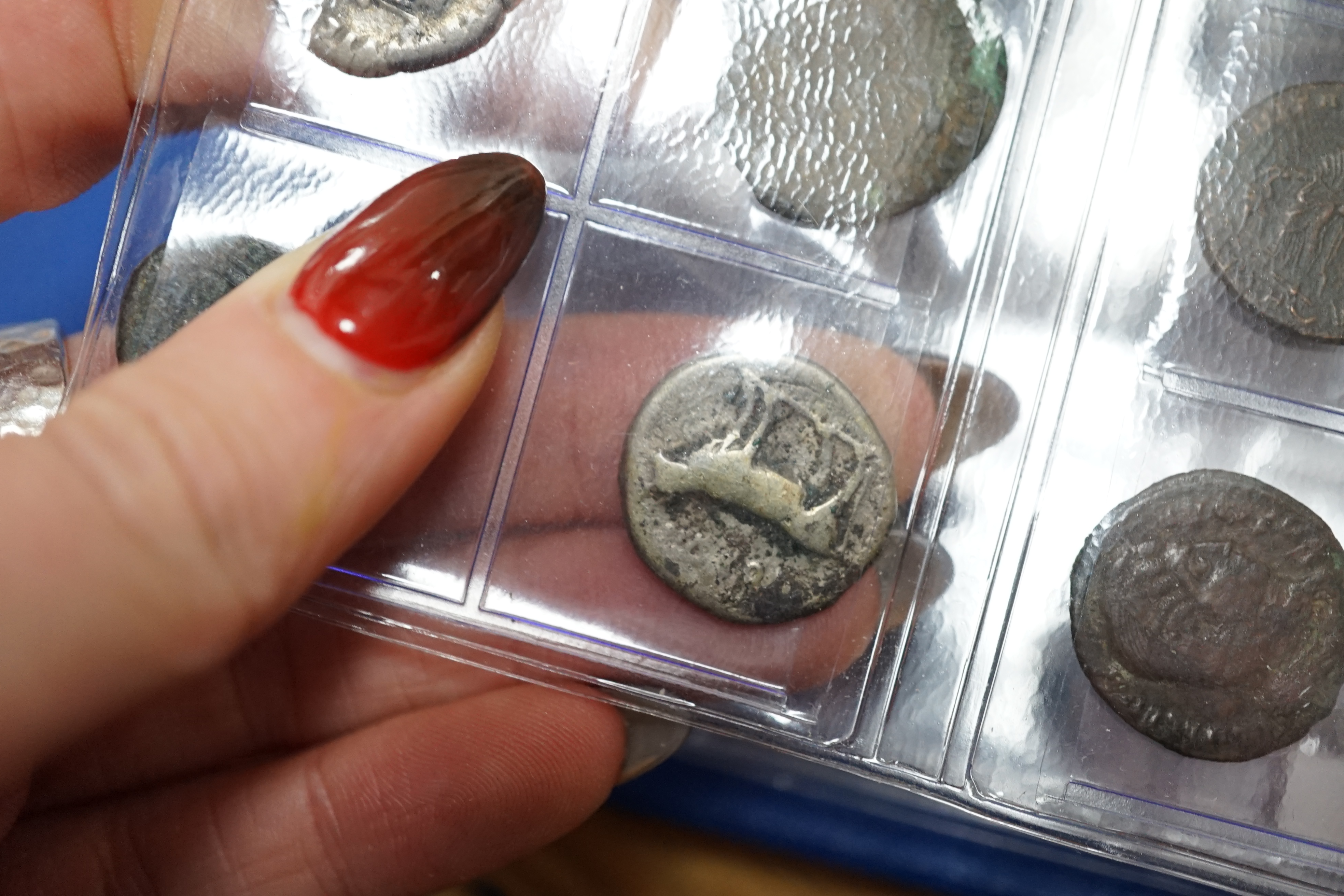 A large collection of Roman AE and AR coins, in an album                                                                                                                                                                    