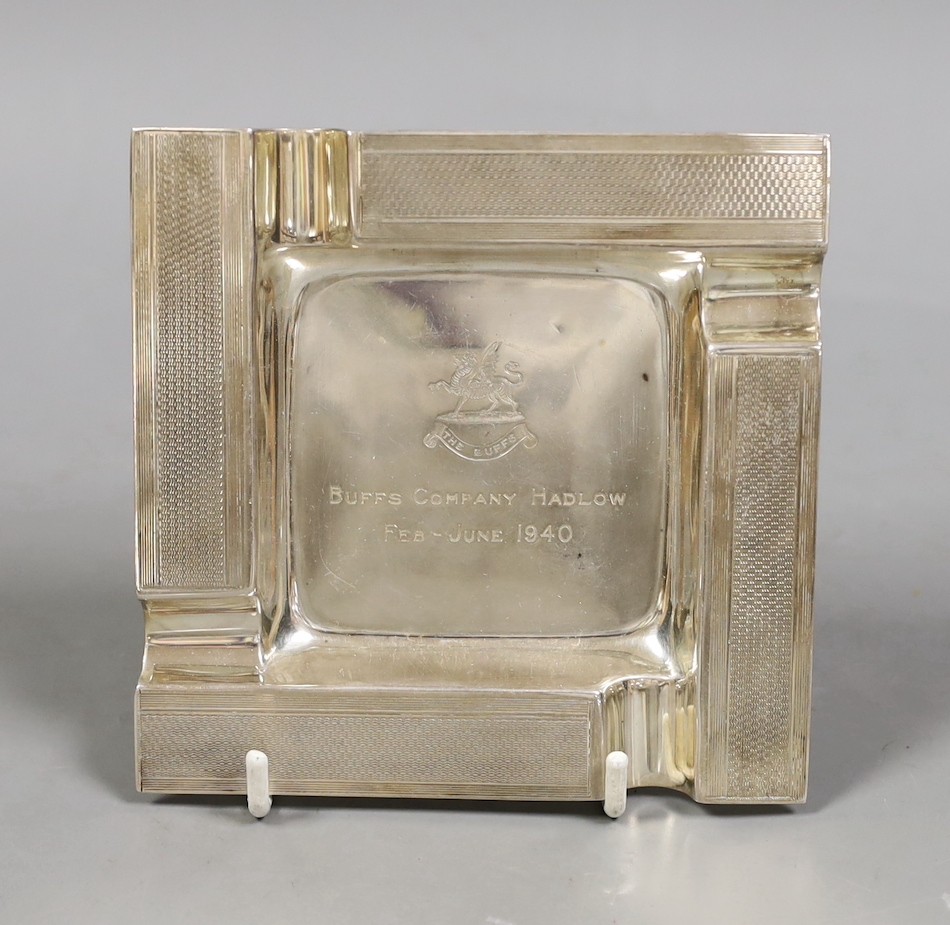 A George VI part engine turned silver ashtray, with military related inscription, Goldsmiths & Silversmiths Co Ltd, London, 1939, 11.7cm, 4oz.                                                                              