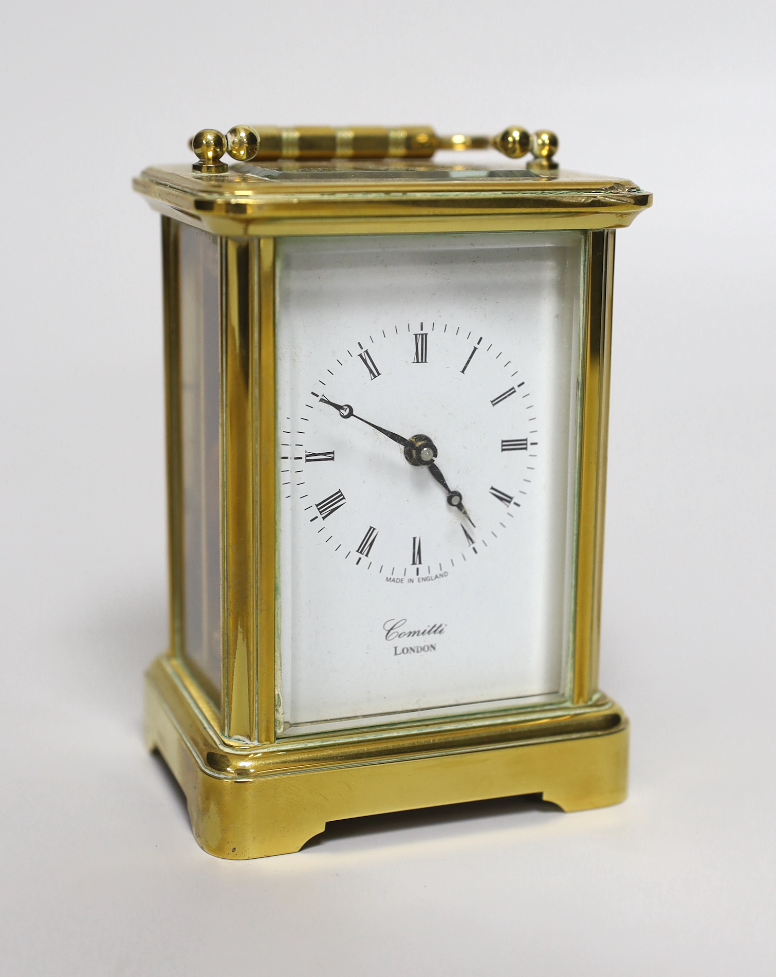 A brass eight day carriage timepiece, retailed by Comitti of London, 12cm high                                                                                                                                              