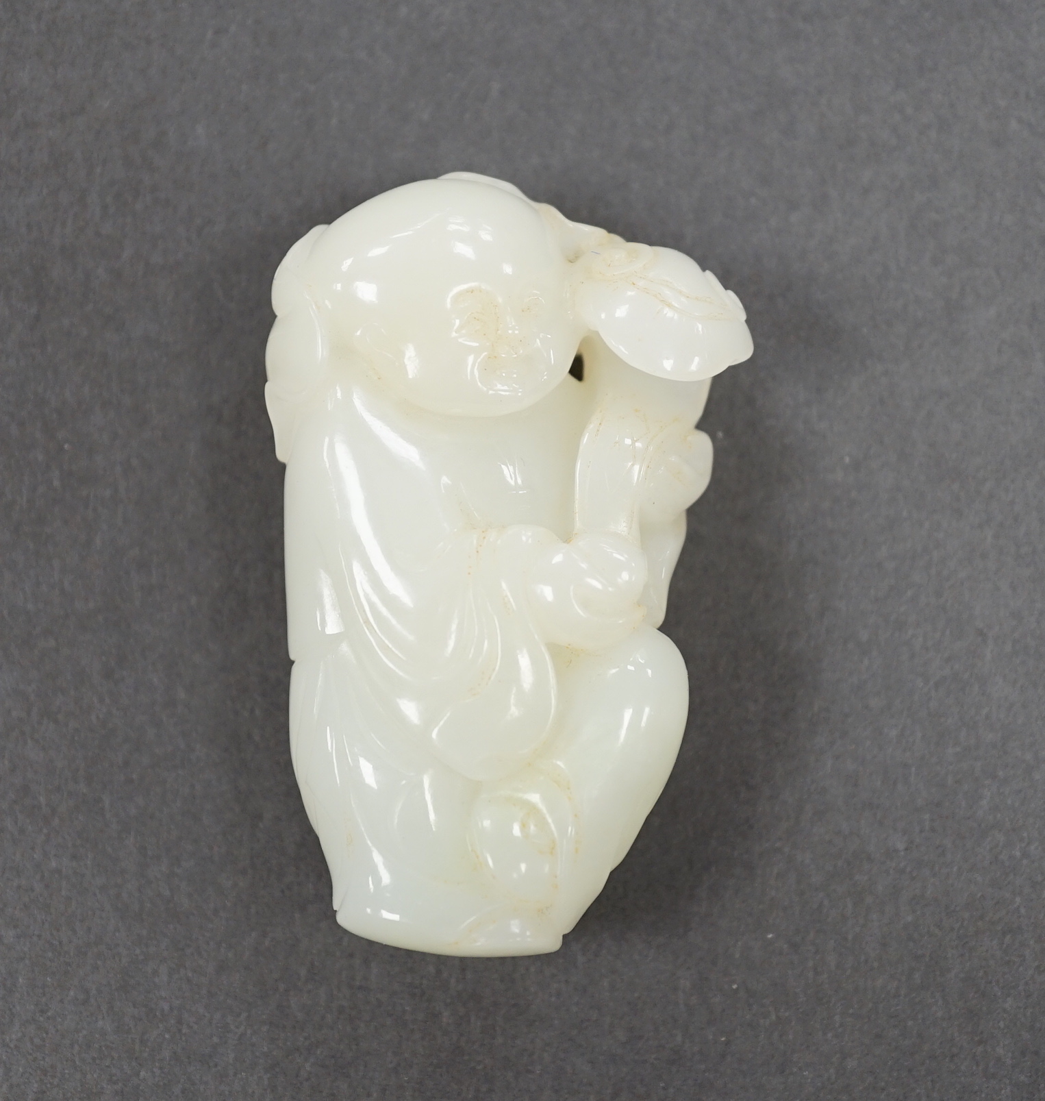 A Chinese white jade boy with ruyi sceptre, 7cm                                                                                                                                                                             