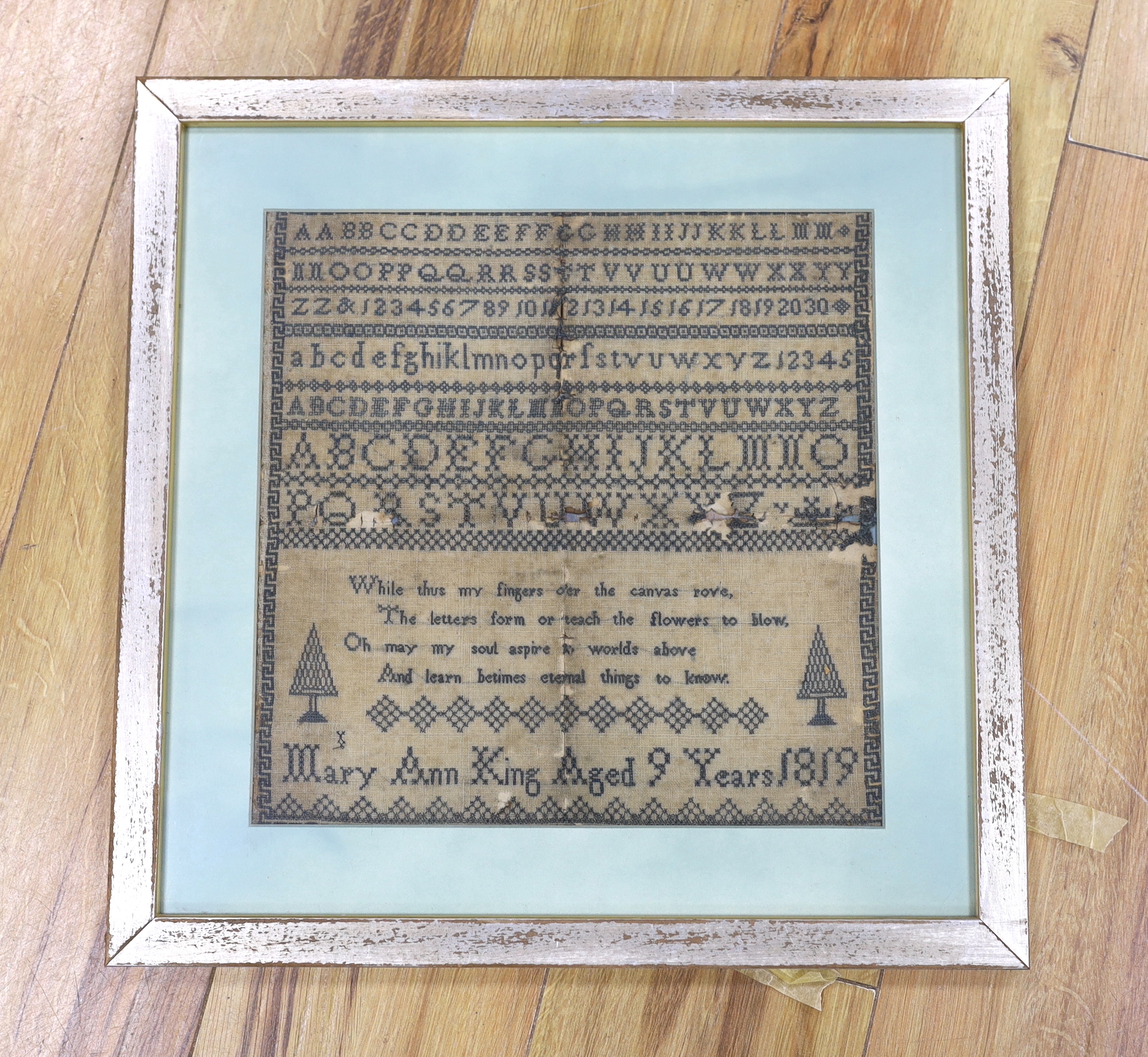 An early 19th century alphabet sampler with verse, worked by Mary Ann King, aged 9, 1819, 31 x 31cm                                                                                                                         
