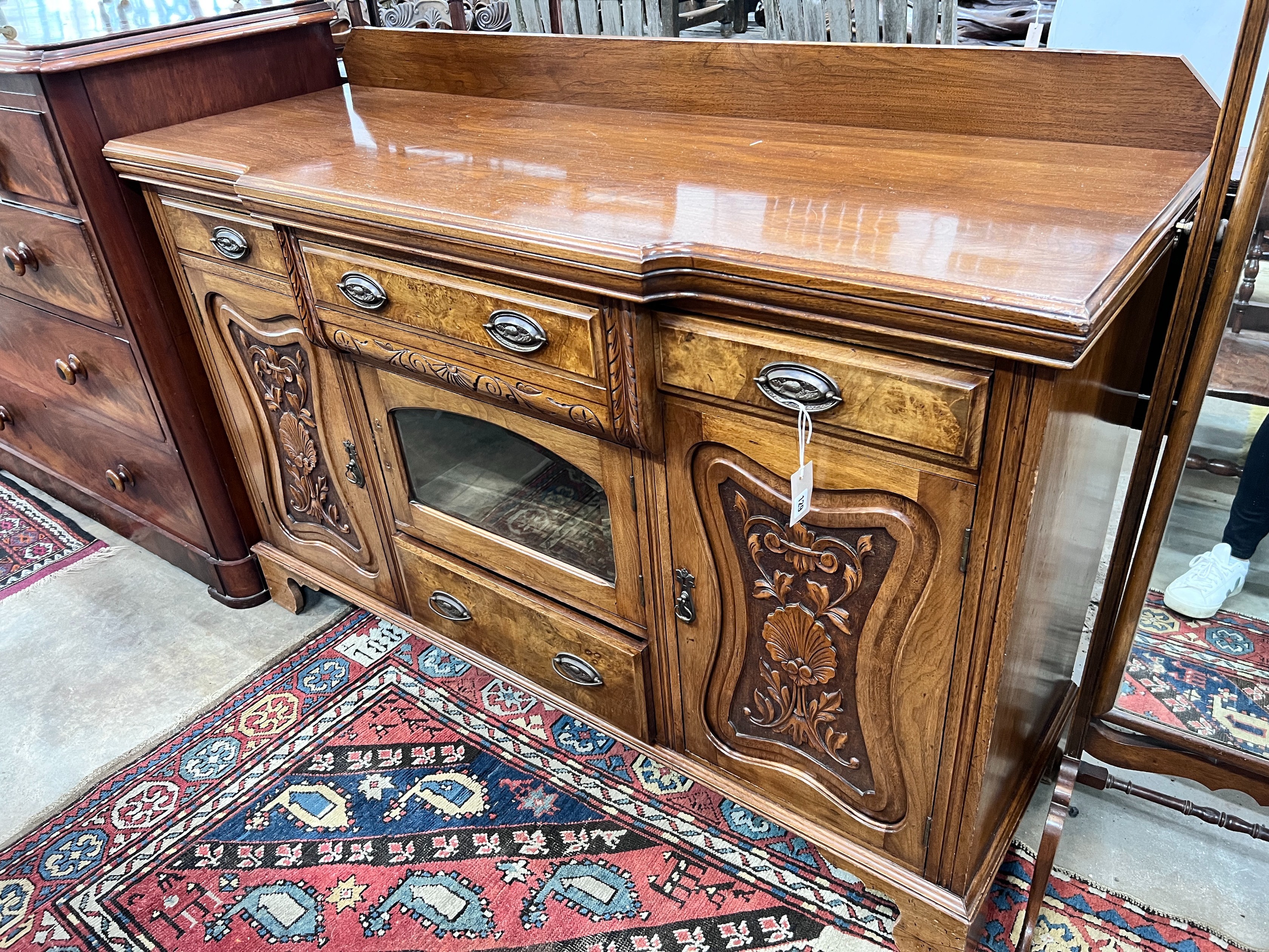 A late Victorian carved walnut breakfront sideboard, length 153cm, depth 52cm, height 107cm *Please note the sale commences at 9am.                                                                                         