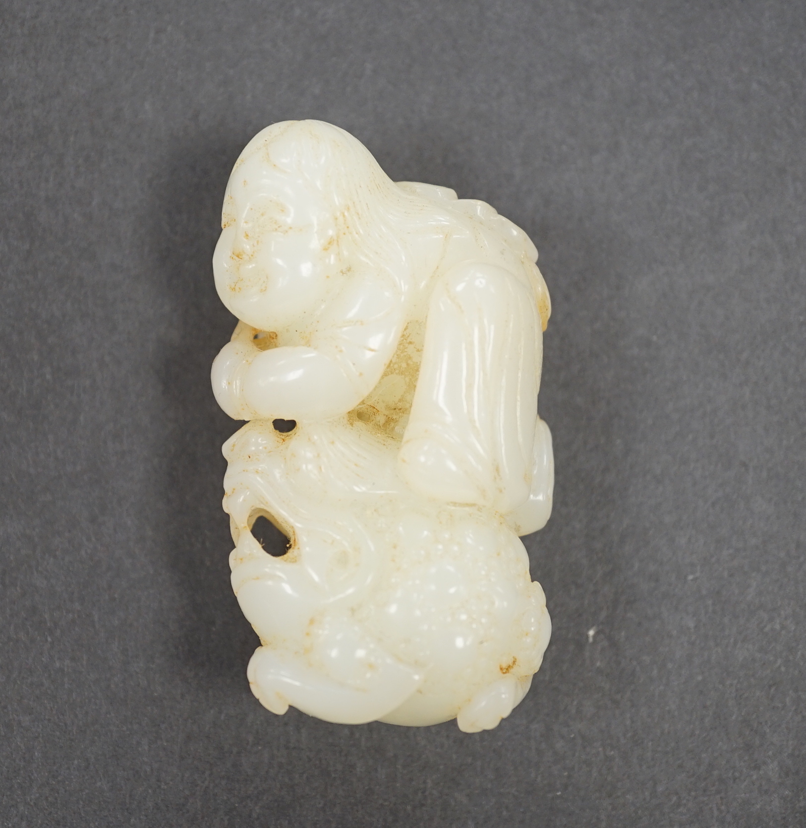 A Chinese white jade group Liu Hai and three three legged toad, 7cm                                                                                                                                                         