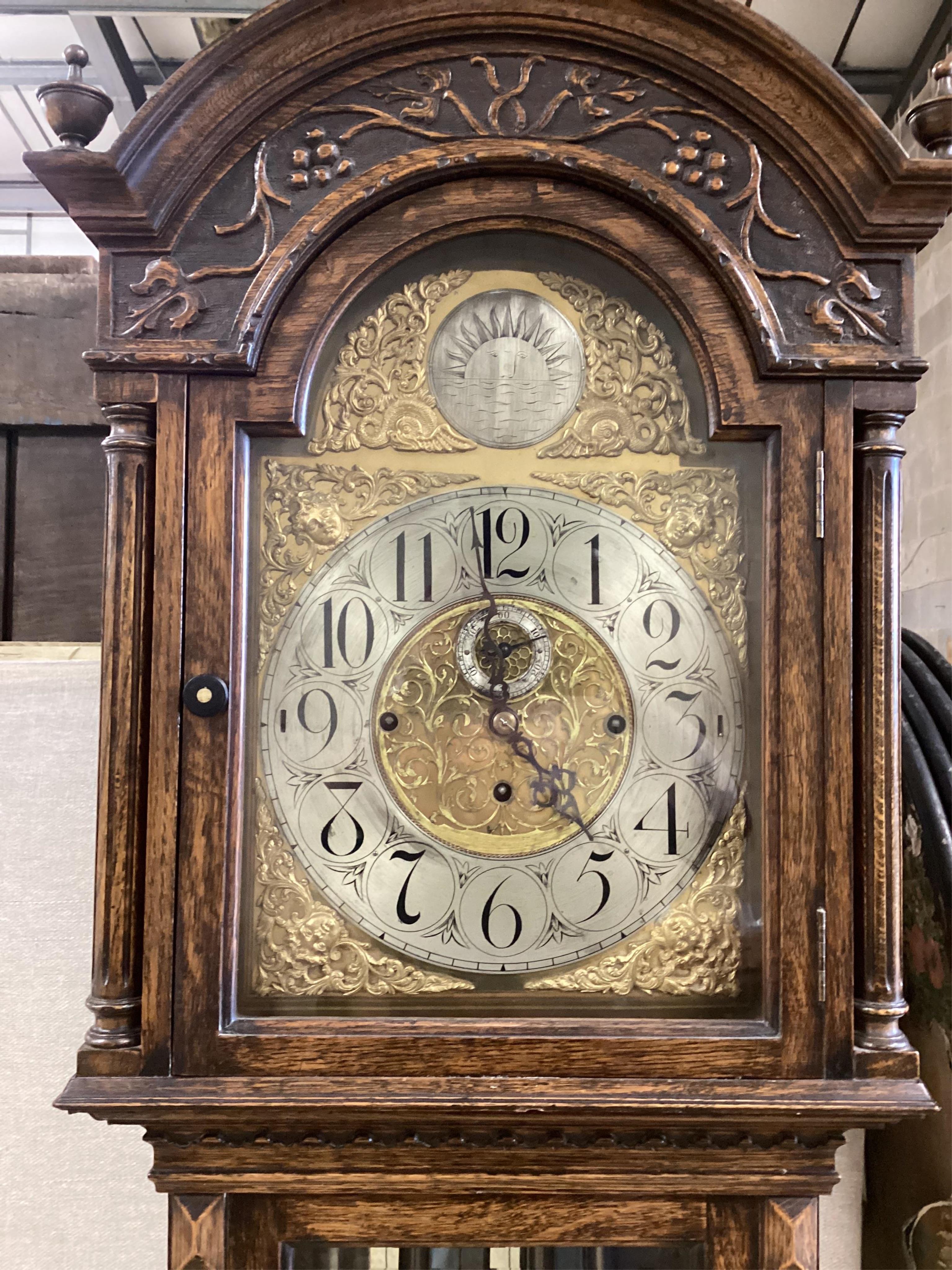 An early 20th century oak chiming longcase clock, height 218cm. Condition - good                                                                                                                                            