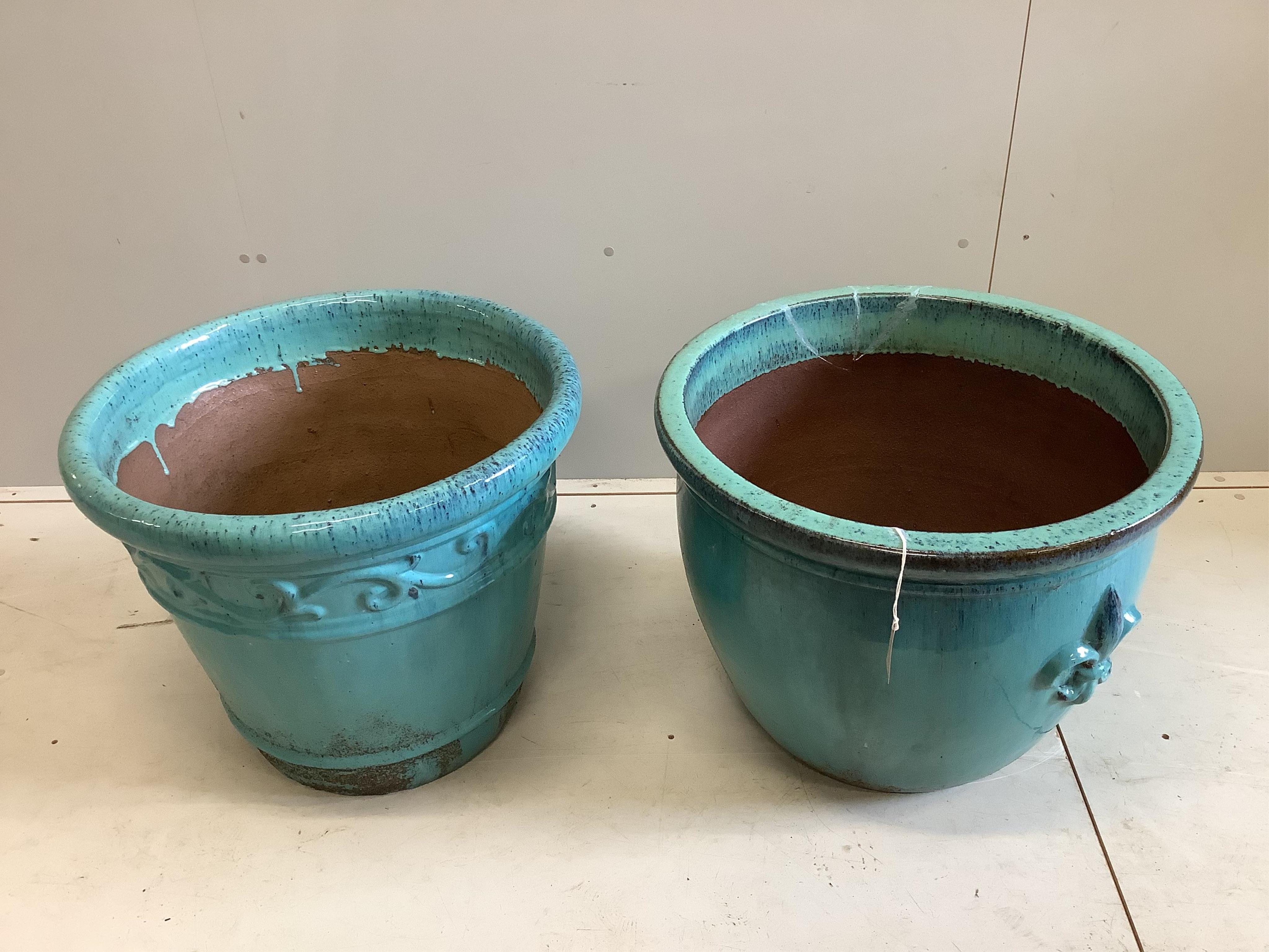 Two large turquoise glazed circular earthenware garden planters, larger diameter 64cm, height 49cm (one a.f.). Condition - fair to good                                                                                     