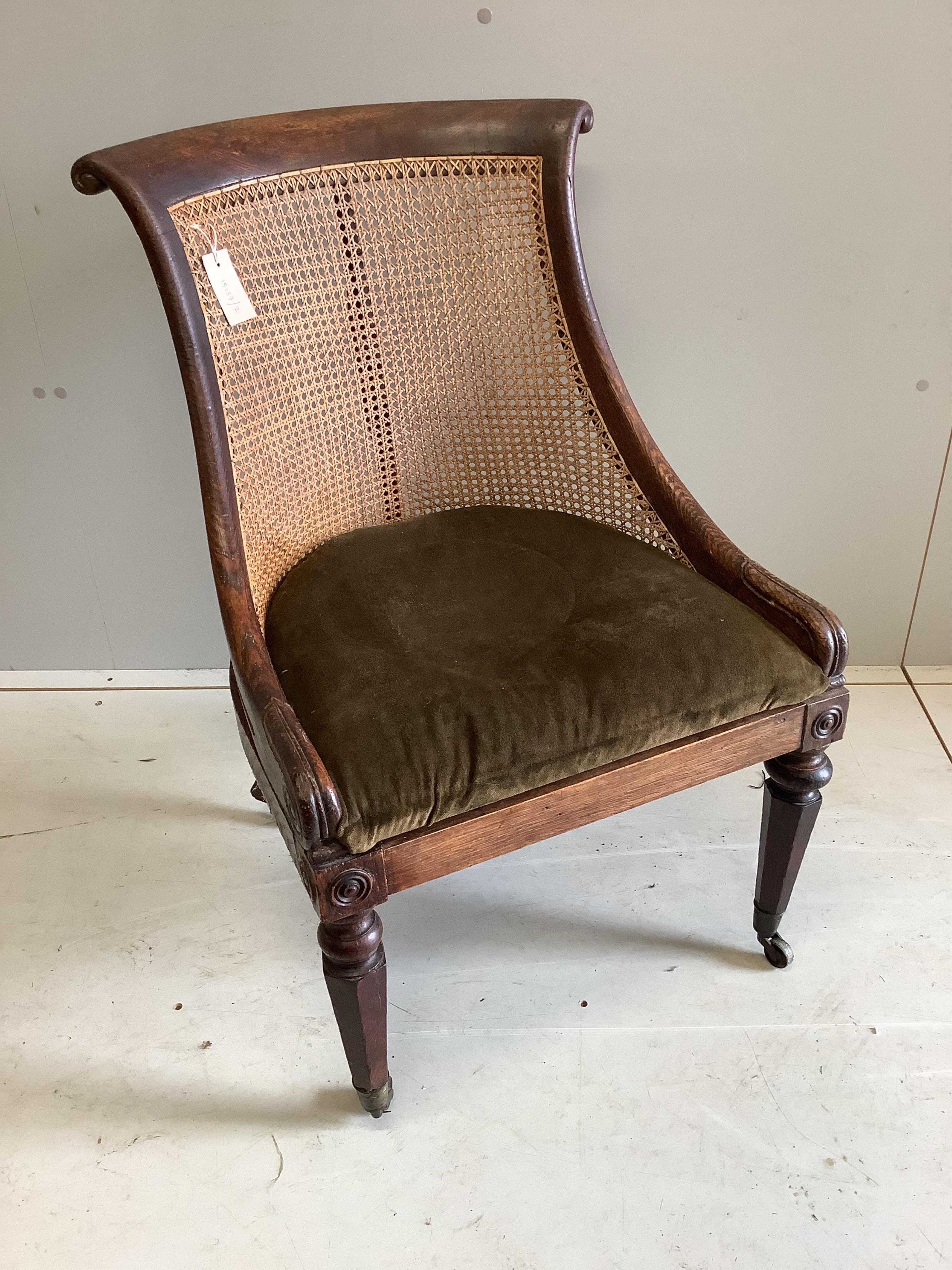 A Regency simulated rosewood oak bergere chair, width 54cm, depth 60cm, height 81cm. Condition - fair                                                                                                                       