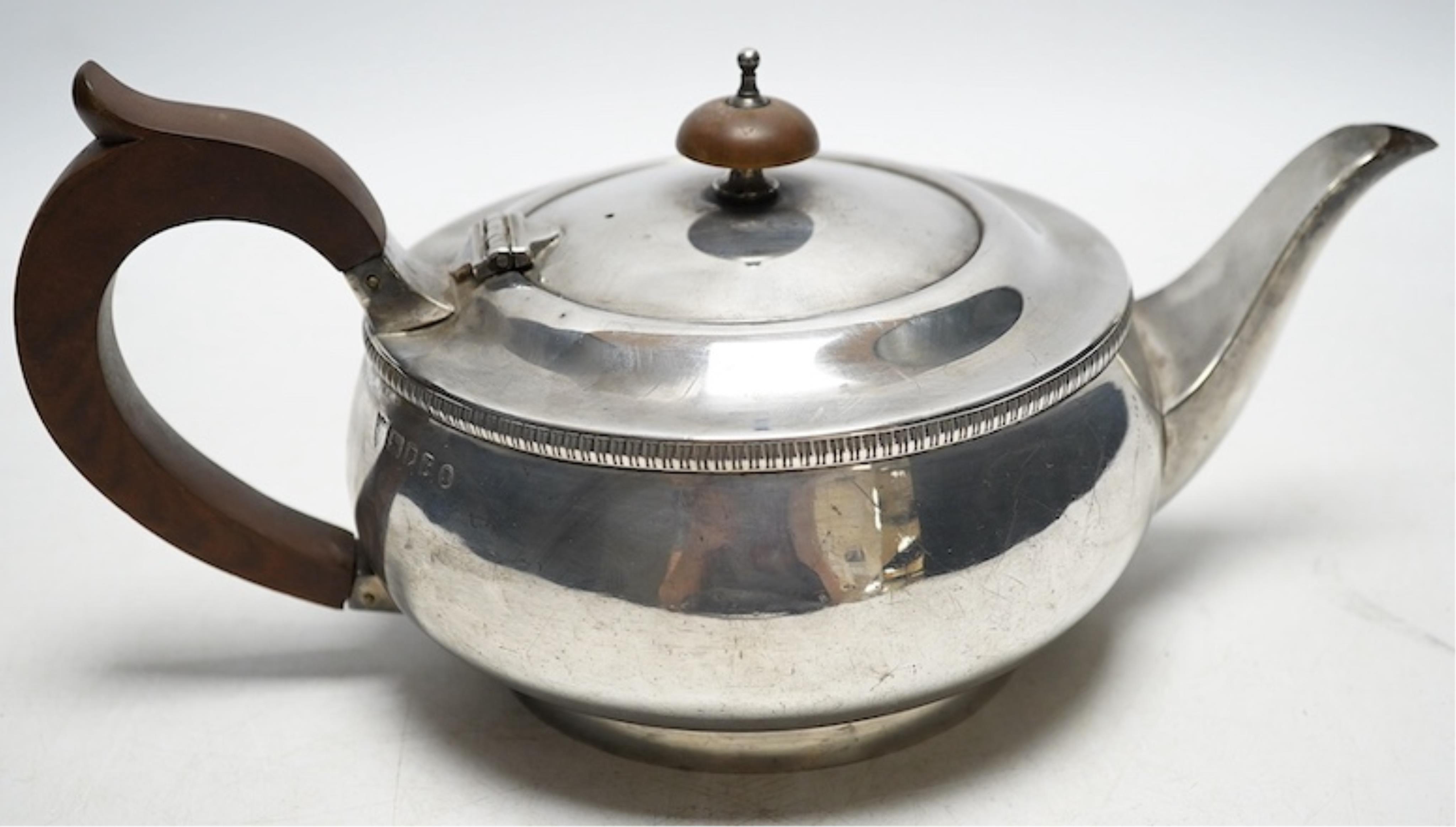 A George V silver teapot, JBC and S Ltd, London 1934, 595g gross. Condition - fair                                                                                                                                          