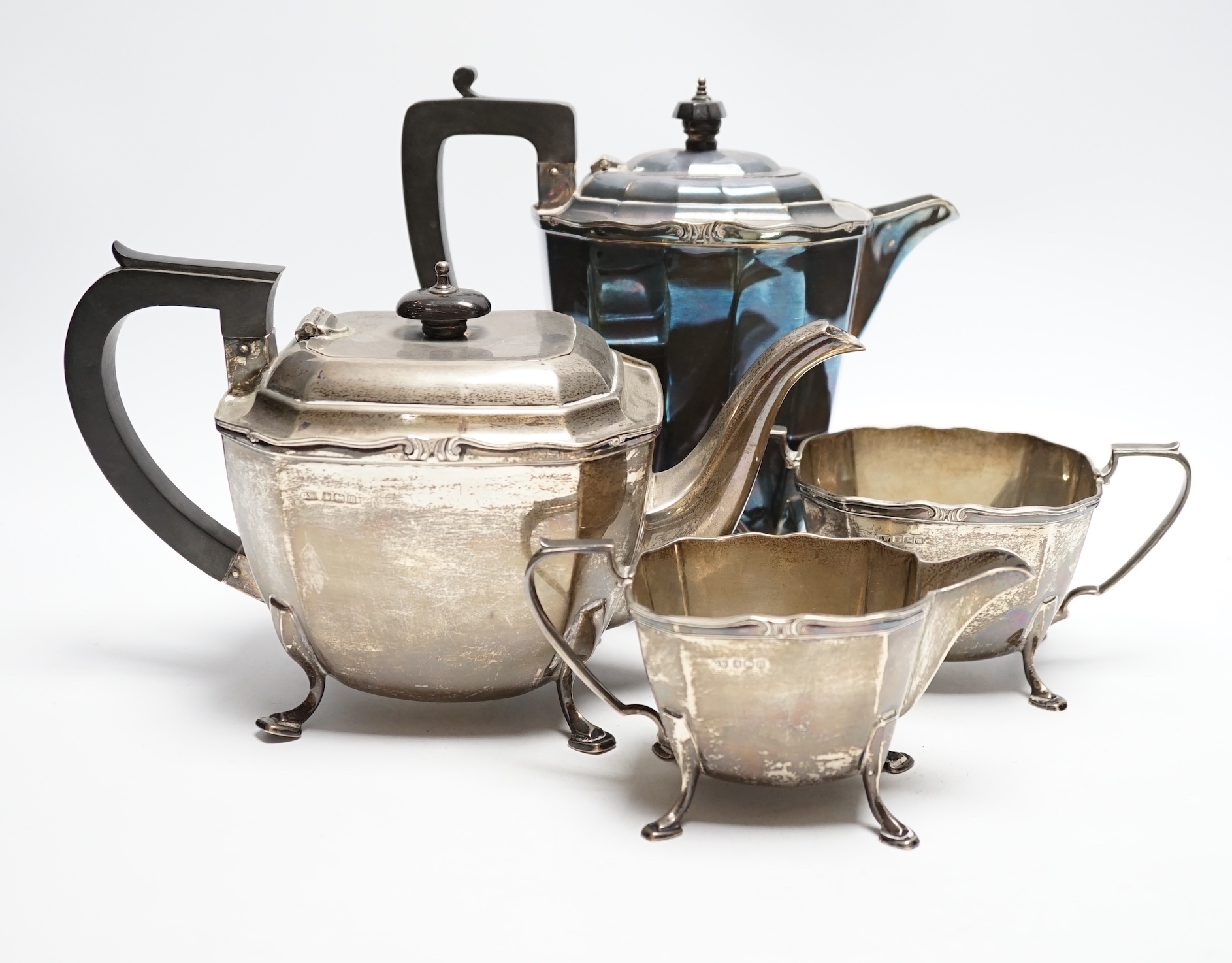 A George V silver three piece silver tea set, George Wish, Sheffield, 1929, 37.6oz, together with a silver plated hot water pot.                                                                                            