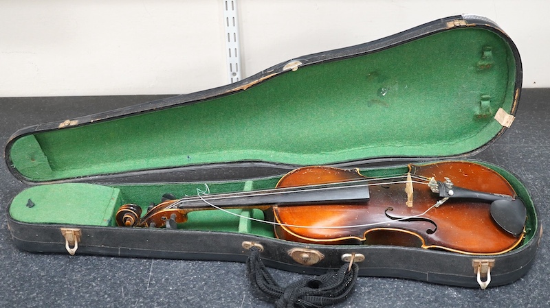 A cased violin, possibly Czech, body 36cm. Condition - fair                                                                                                                                                                 