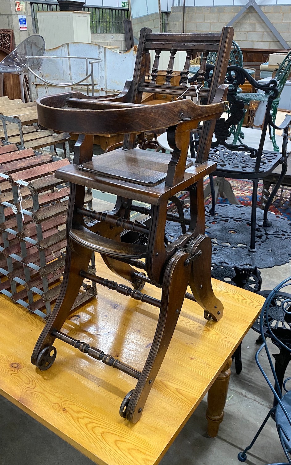 A late Victorian mahogany metamorphic child's high chair                                                                                                                                                                    