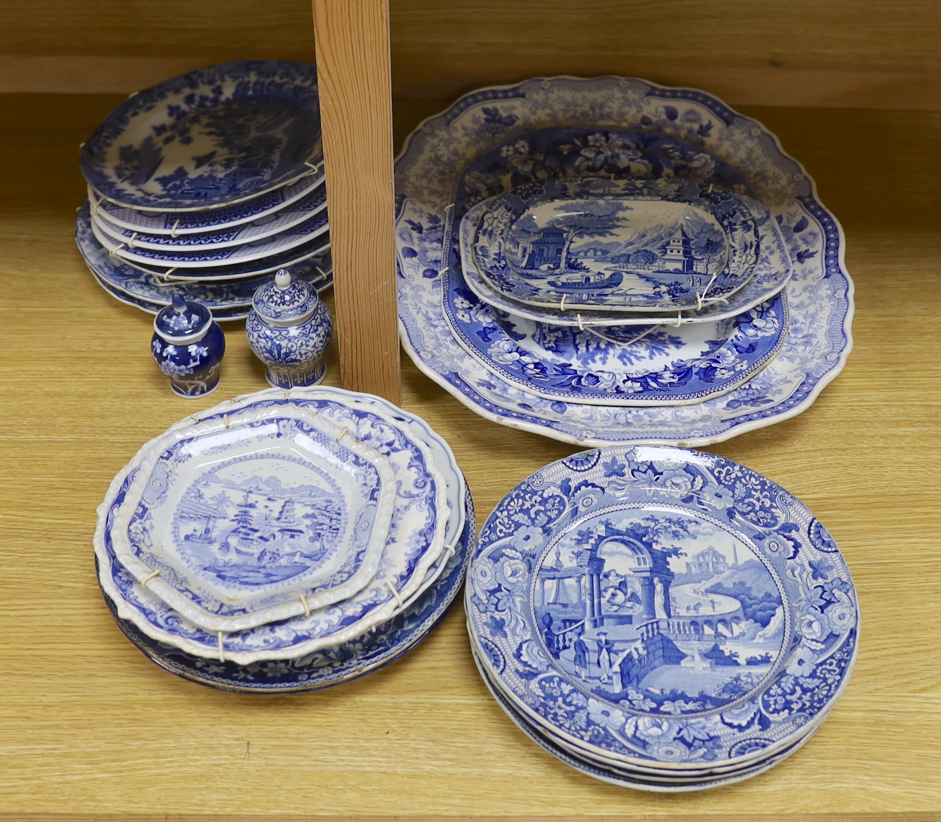 An early 19th century John Meir and Sons blue and white printed 'Fairy Villas' meat dish together with a collection of Staffordshire and other blue and white dishes and two baluster jars and covers, the largest 50cm wide