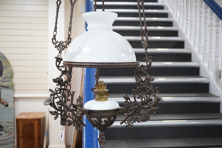 A French barn iron and white glass hanging lamp, approximately 140cm high. Condition - used, iron work needs cleaning                                                                                                       