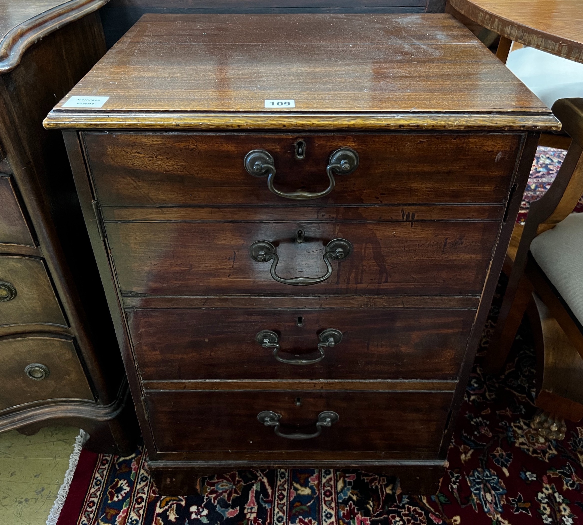 A George III and later mahogany side cabinet with dummy drawer front, incorporates old timber, width 53cm, depth 43cm, height 72cm                                                                                          