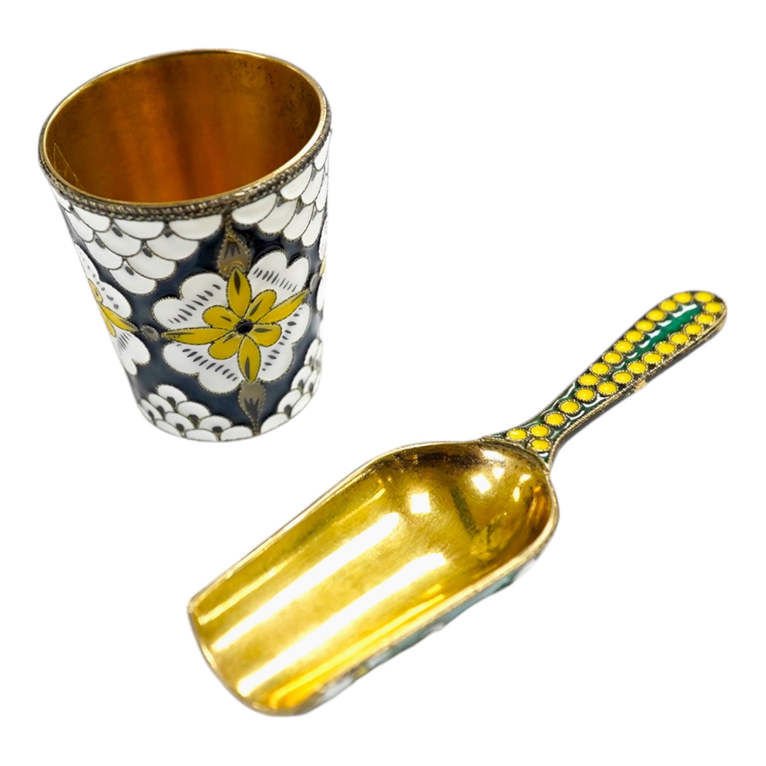 A Soviet Union 916 gilt white metal and enamel caddy spoon, 91mm and vodka tot, 44mm. Condition - good                                                                                                                      