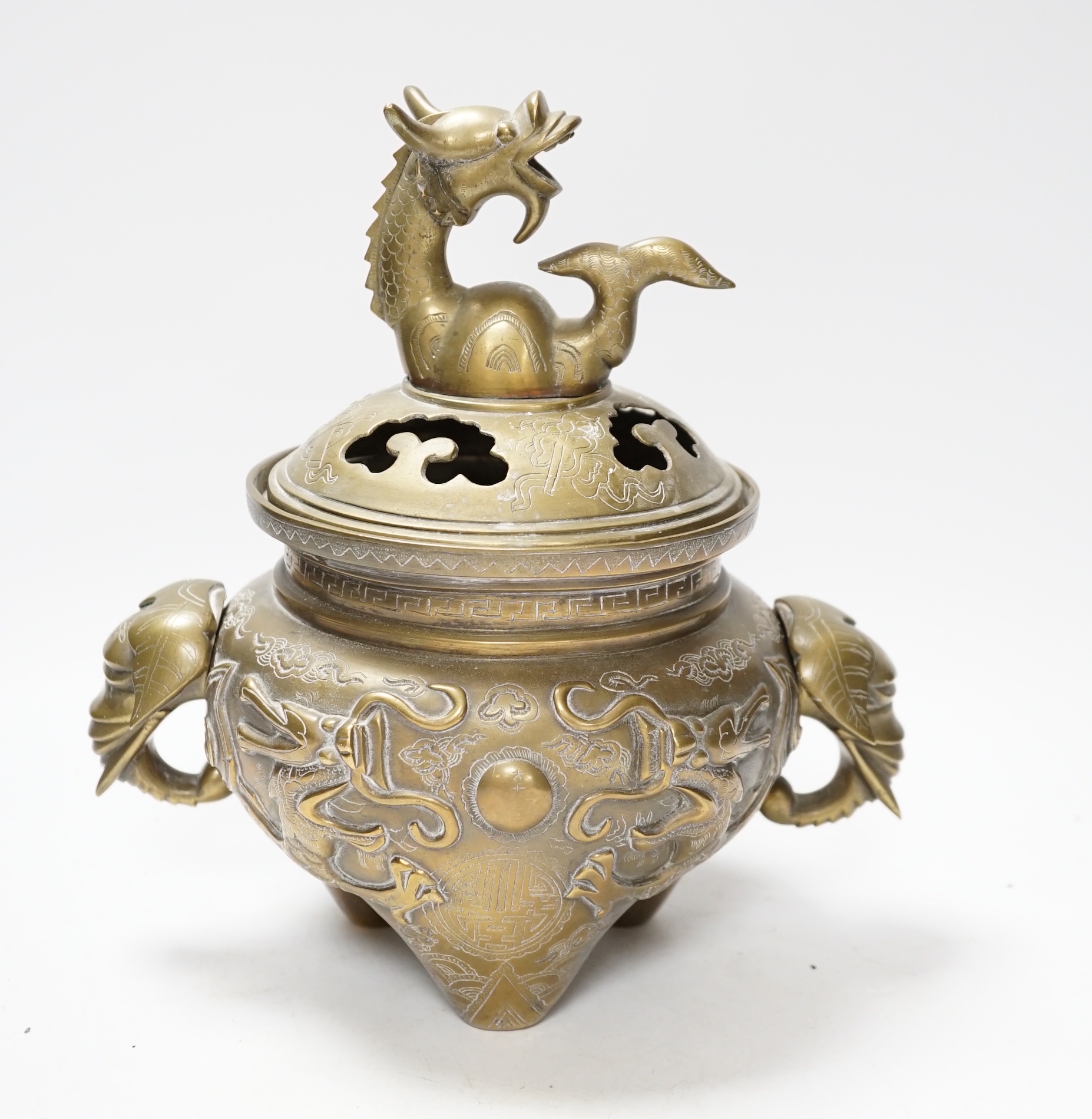 A Chinese bronze ‘dragon’ tripod censer and cover, 24cm                                                                                                                                                                     