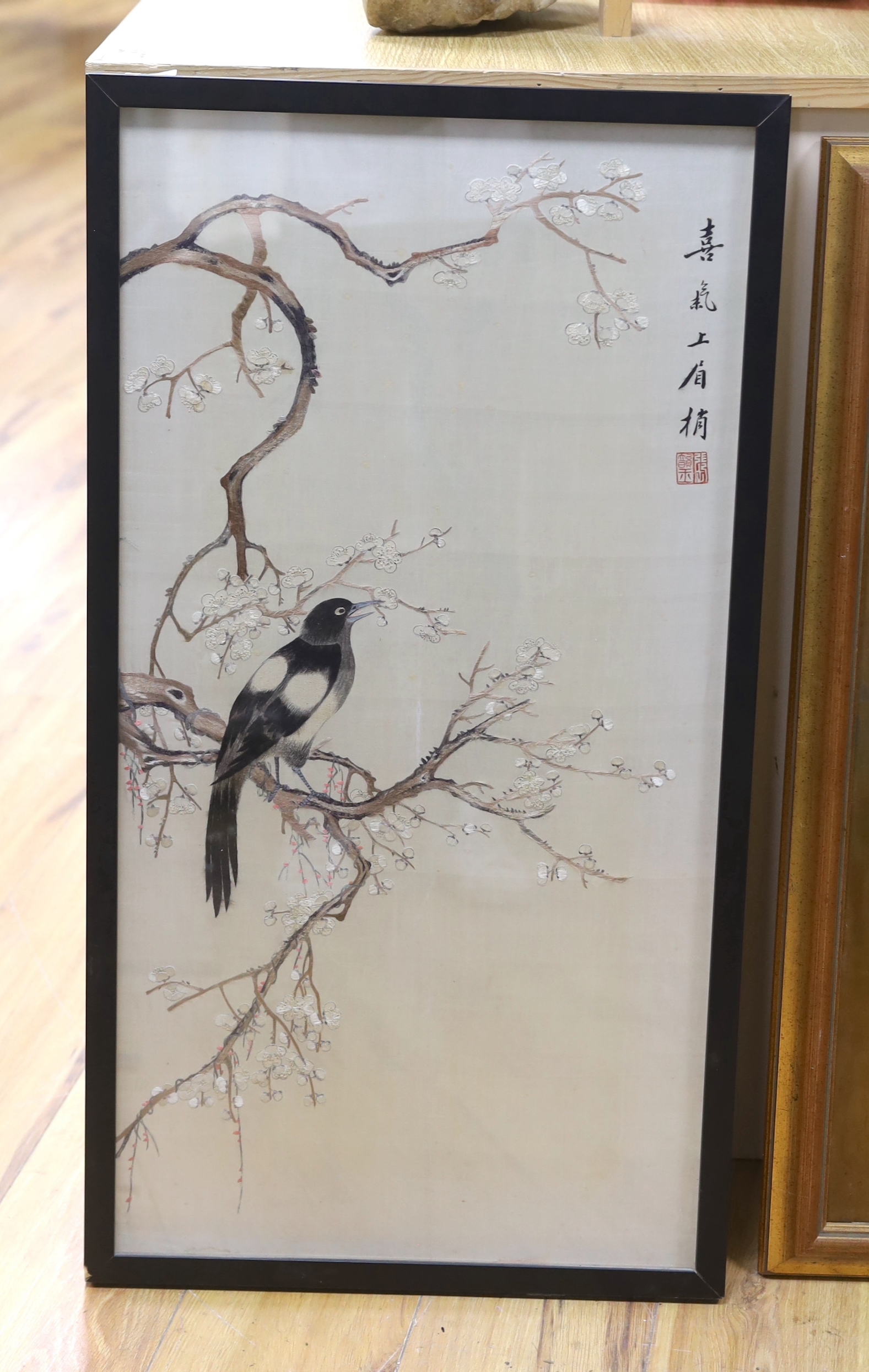 An early 20th century framed Japanese silkwork of a magpie                                                                                                                                                                  