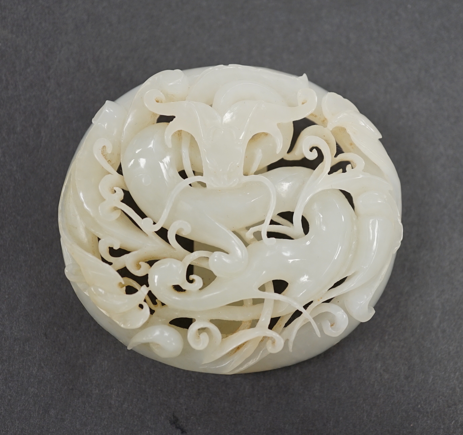 A 17th/18th century Chinese white jade ‘dragon’ belt buckle, 7cm                                                                                                                                                            