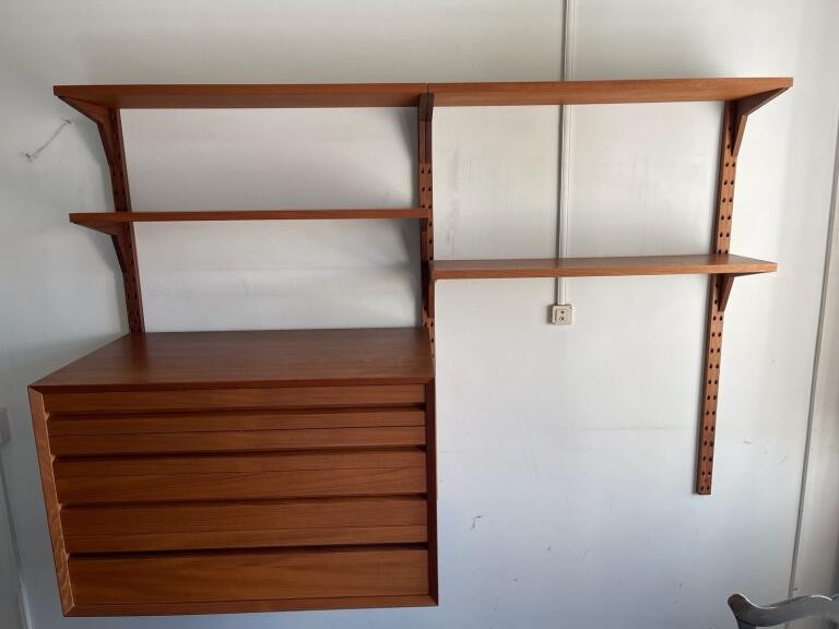 A mid century teak Poul Cadovius teak 'Lado' wall shelving system                                                                                                                                                           