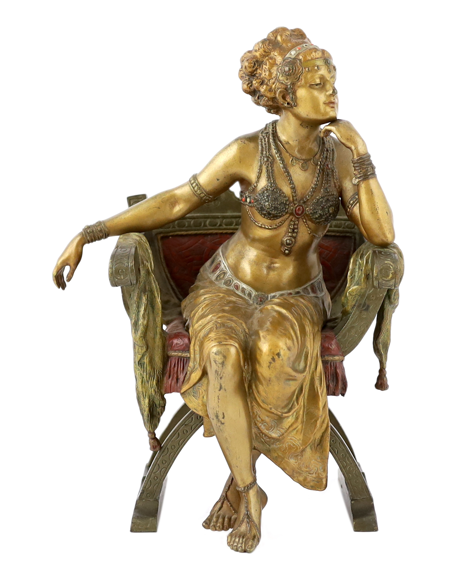Franz Xavier Bergmann (1861-1936). An Austrian cold painted and patinated cast bronze figure of a Turkish dancing girl seated in an armchair, 20cm wide, 29cm high, Please note this lot attracts an additional import tax o