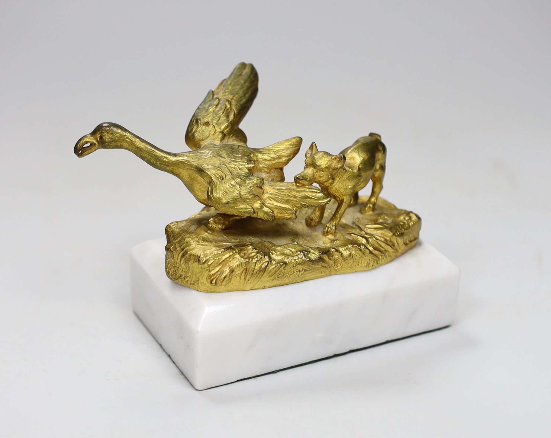 A gilt-bronze model dog and duck signed Mauroy, on marble base, 13.5cm long                                                                                                                                                 