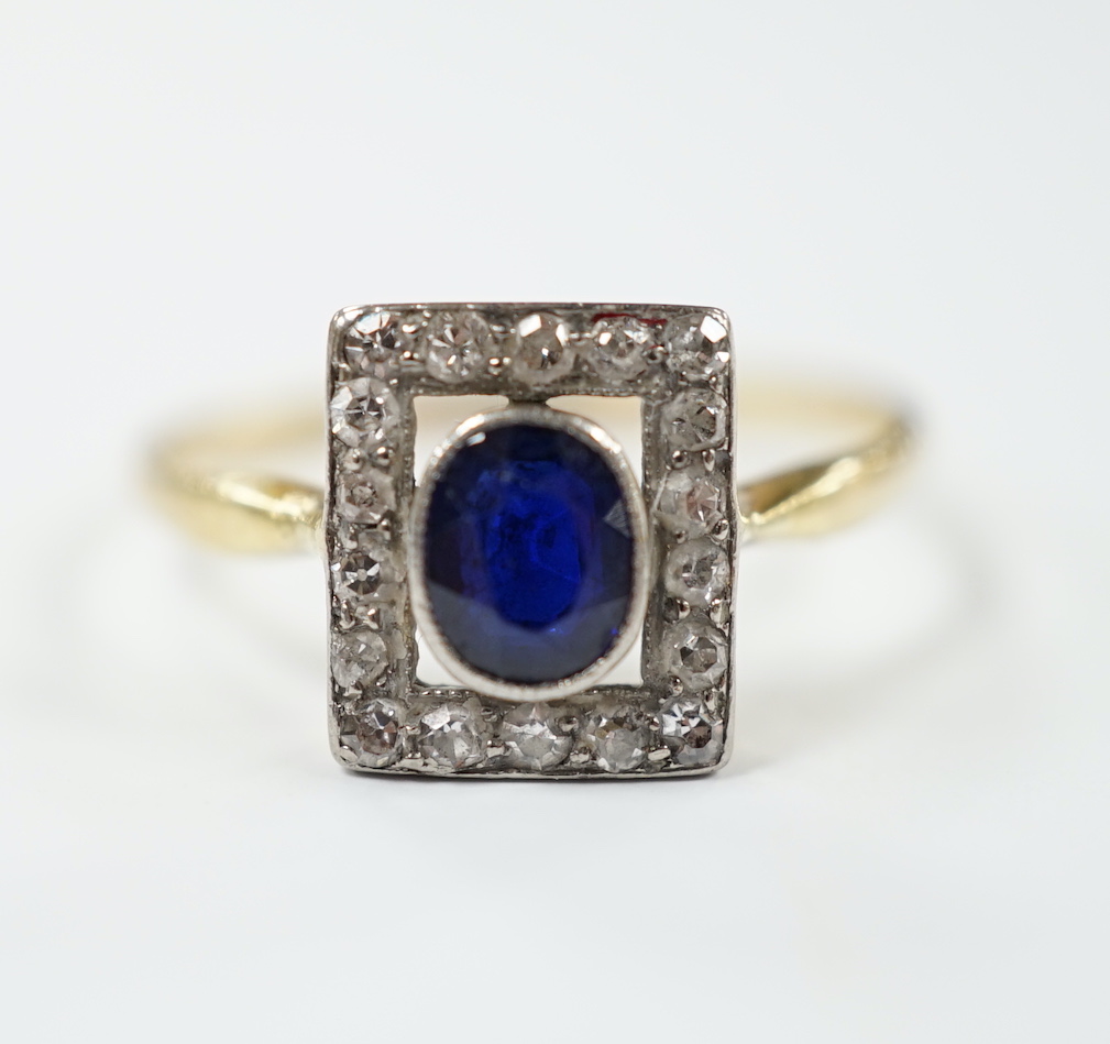 A yellow metal, sapphire and diamond cluster set tablet ring, size P, gross weight 2.3 grams.                                                                                                                               