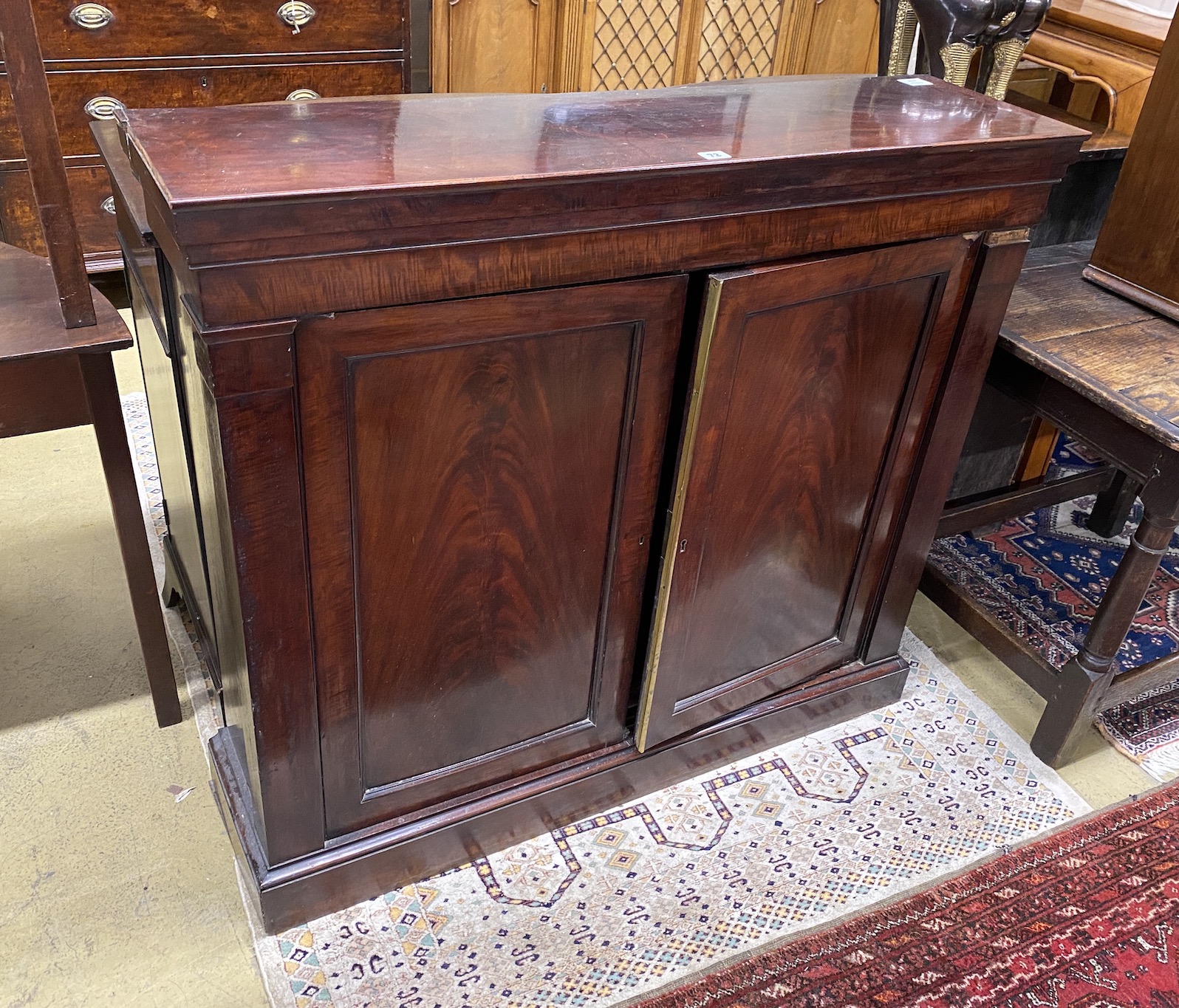 A Victorian mahogany side cabinet, width 114cm, depth 31cm, height 100cm                                                                                                                                                    