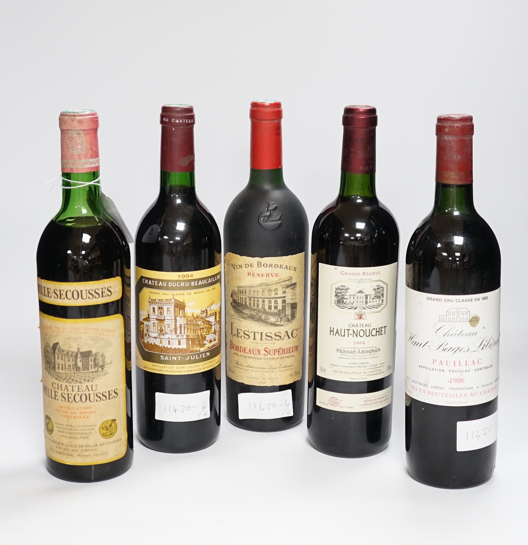 One bottle of Chateau Ducru Beaucaillou, 1994 and four other clarets including Chateau Haut Bages Liberal, 1986.                                                                                                            