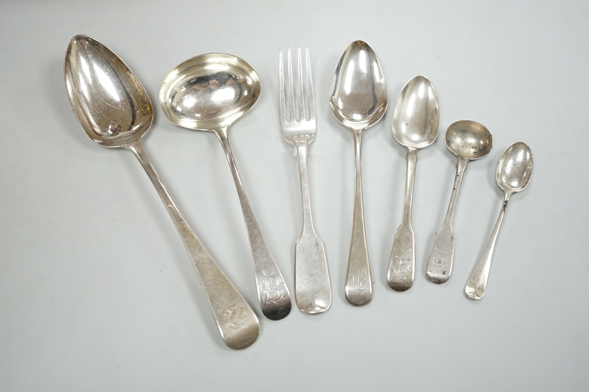 A collection of George III and later silver flatware including a sauce ladle, six Old English pattern tablespoons and a fiddle pattern tablespoon, nine dessert forks, six dessert spoons and twenty seven tea, coffee and s