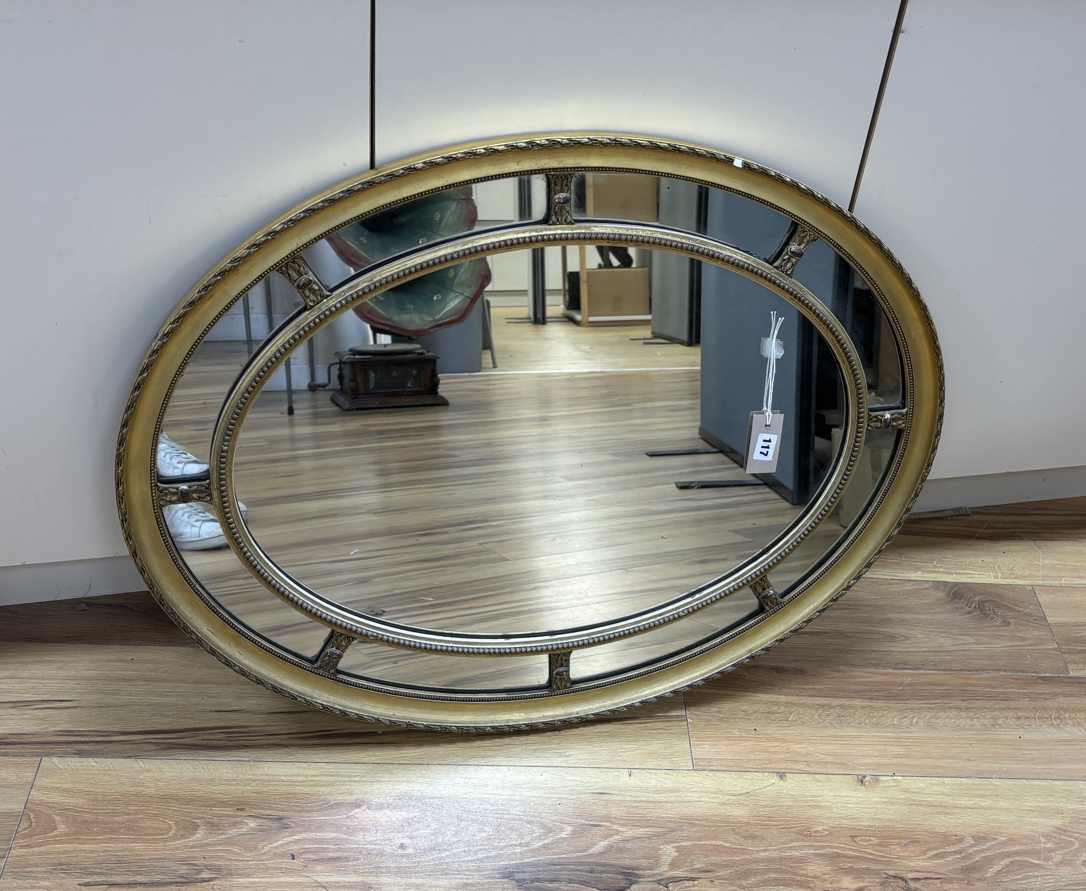An oval marginal plate wall mirror, width 86cm, height 66cm                                                                                                                                                                 
