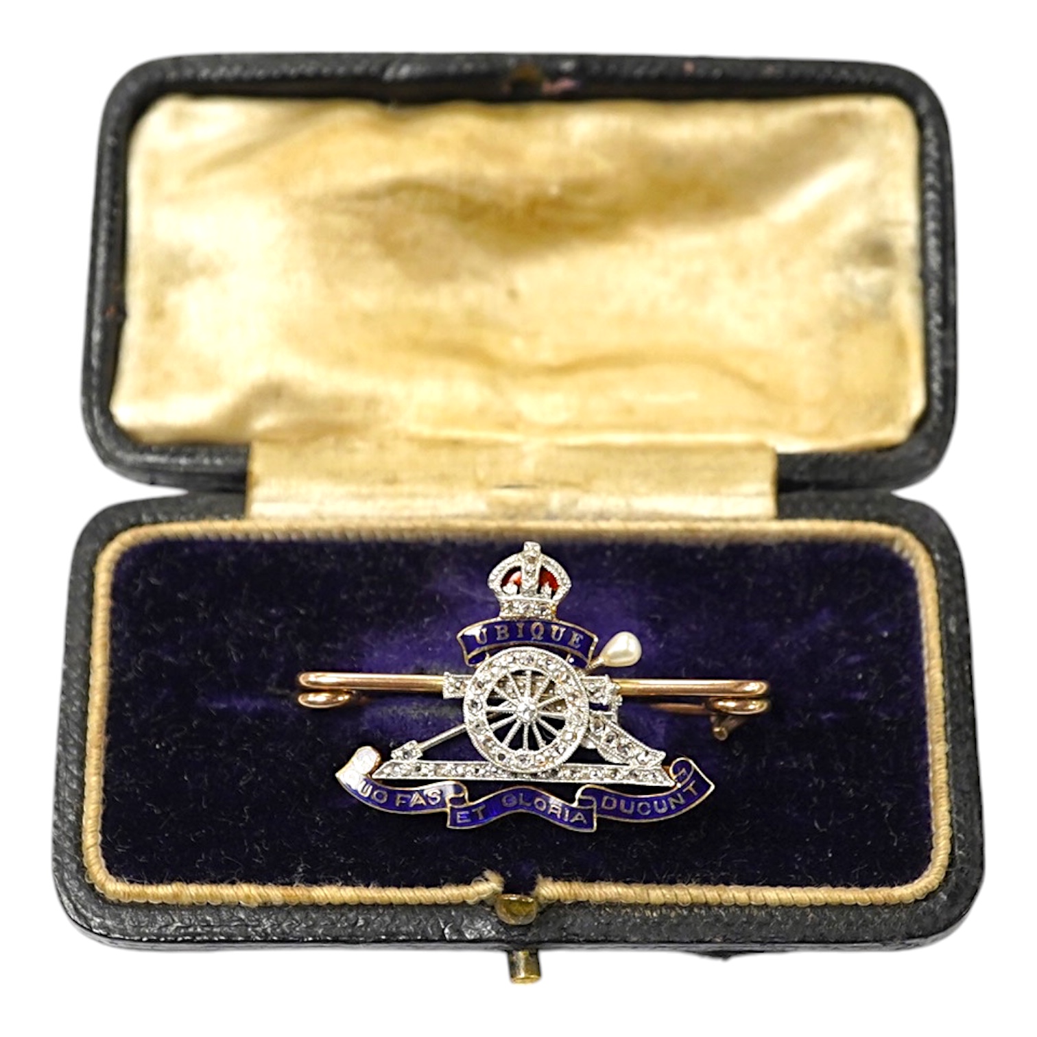 A cased early 20th century 9c, enamel and diamond set Royal Artillery sweethearts brooch, 37mm, gross weight 6.3 grams. Condition - good                                                                                    