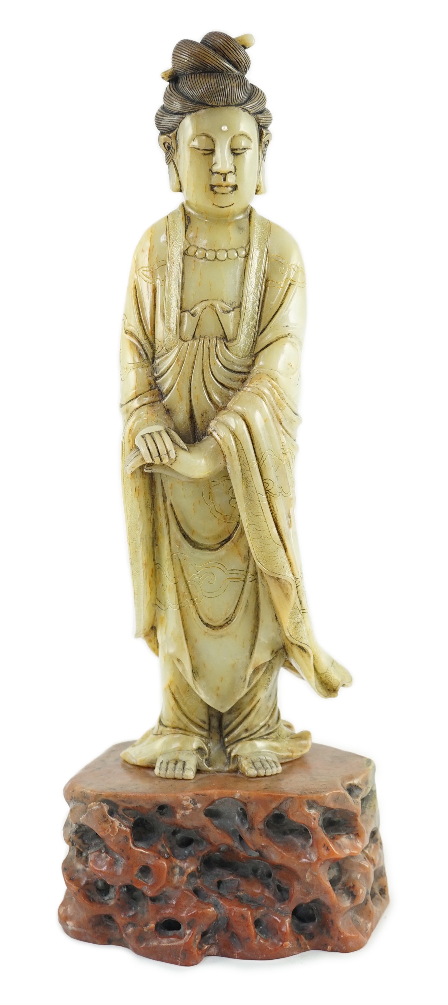 A Chinese soapstone standing figure of Guanyin, 19th century, 38cm high                                                                                                                                                     